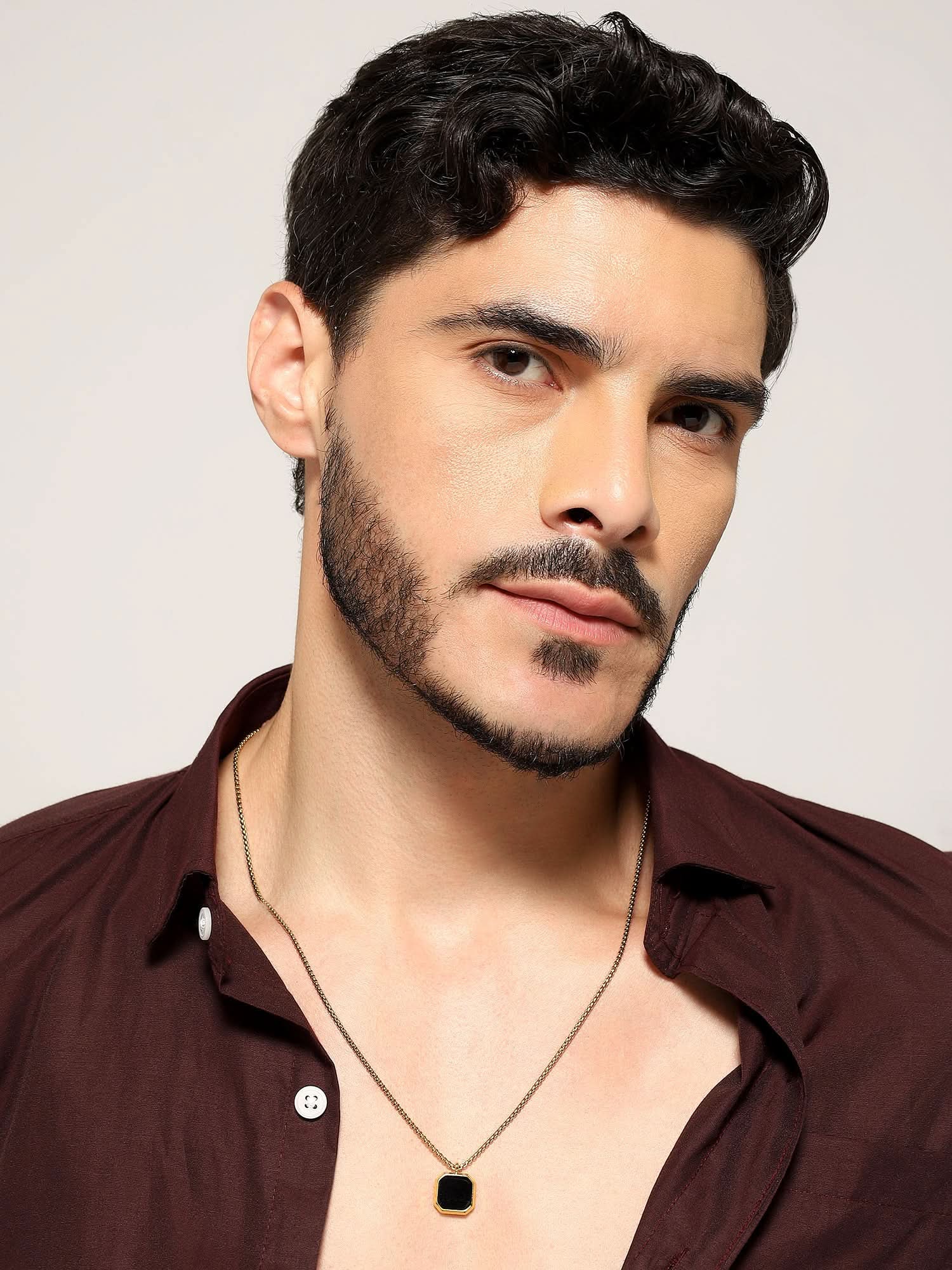 Model wearing Cuban Box Chain Enamel Square Pendant in gold — men's gold pendant styled on hand