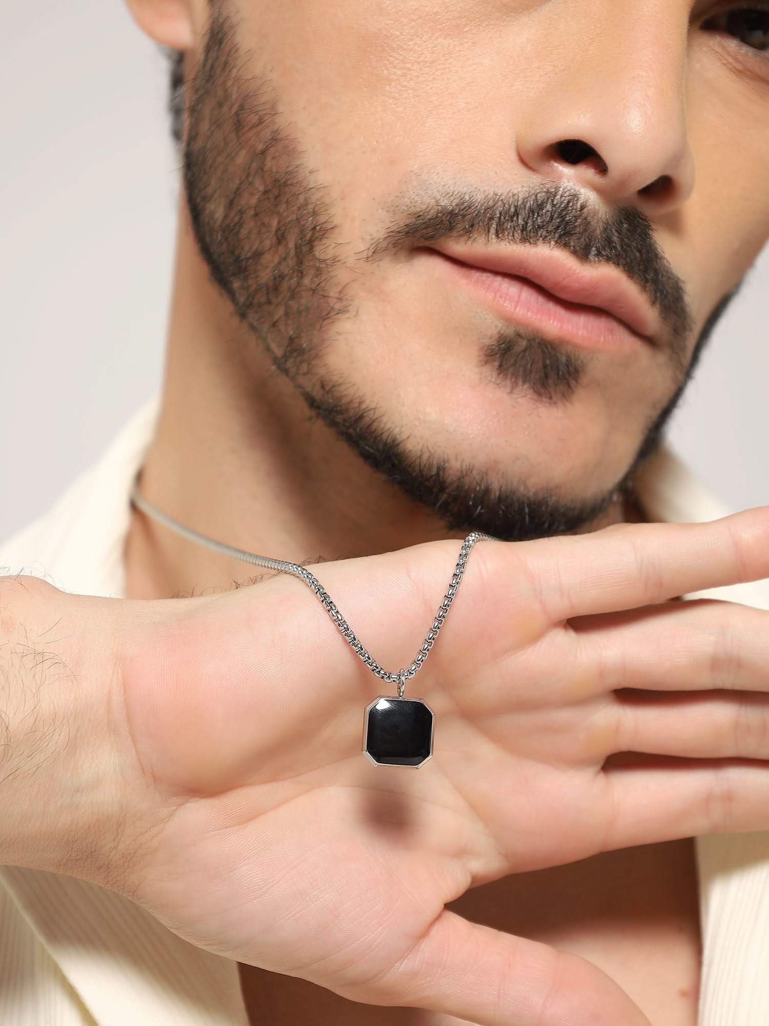 Model wearing Cuban Box Chain Enamel Square Pendant in silver — men's silver pendant styled on hand