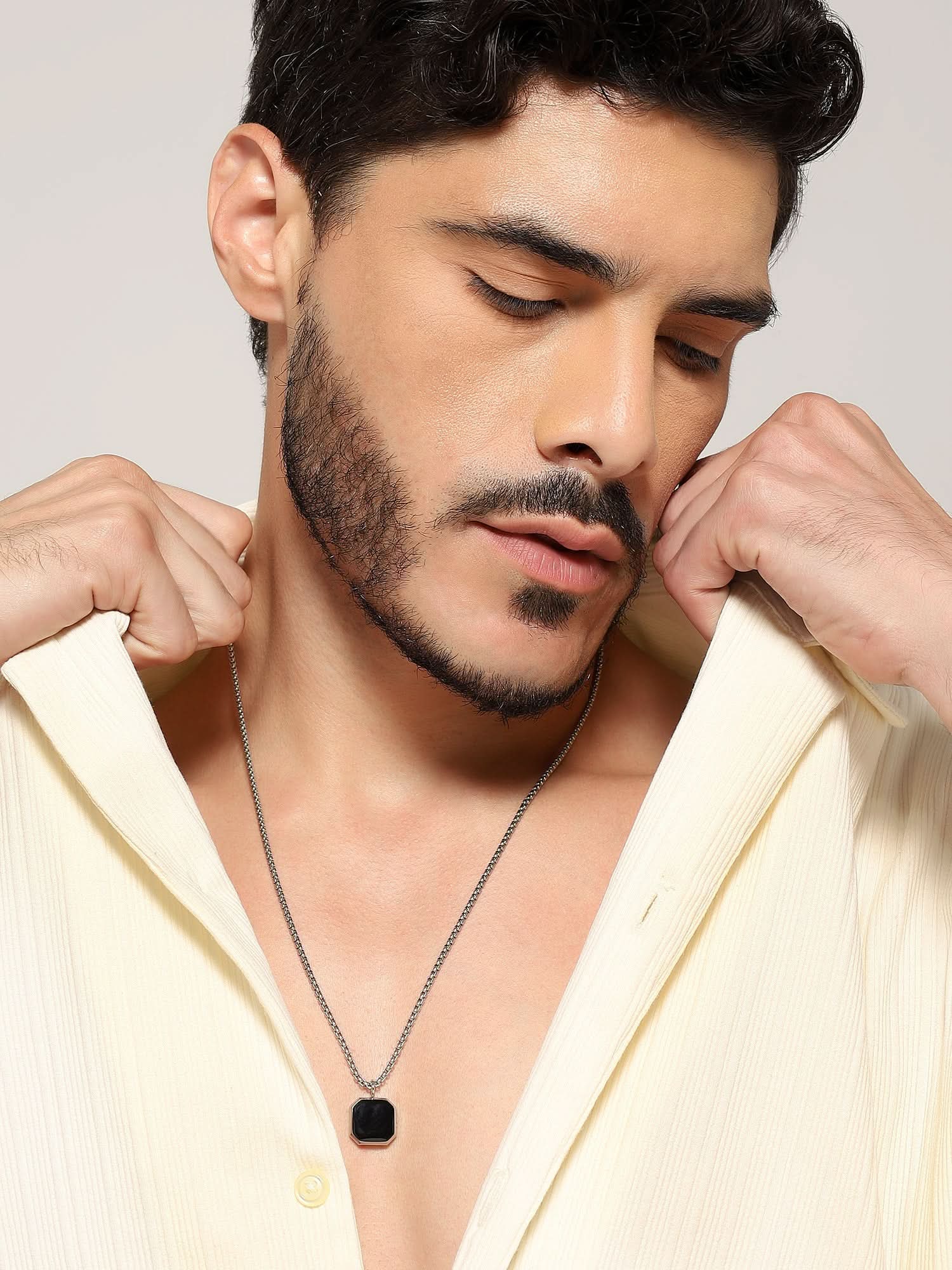 Model wearing Cuban Box Chain Enamel Square Pendant in silver — men's silver pendant styled on hand