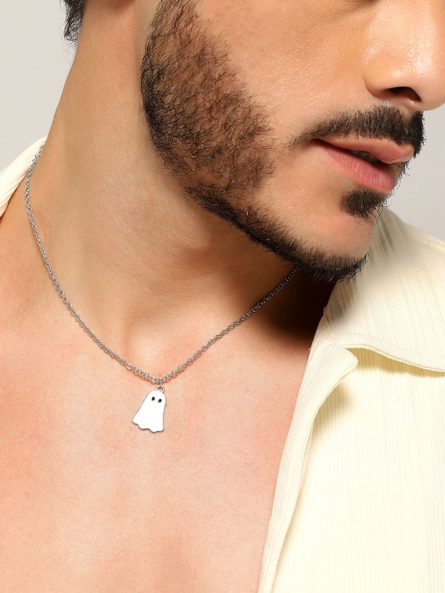 Model wearing Halloween Cute Cartoon Ghost Pendant in white — men's white pendant styled on hand