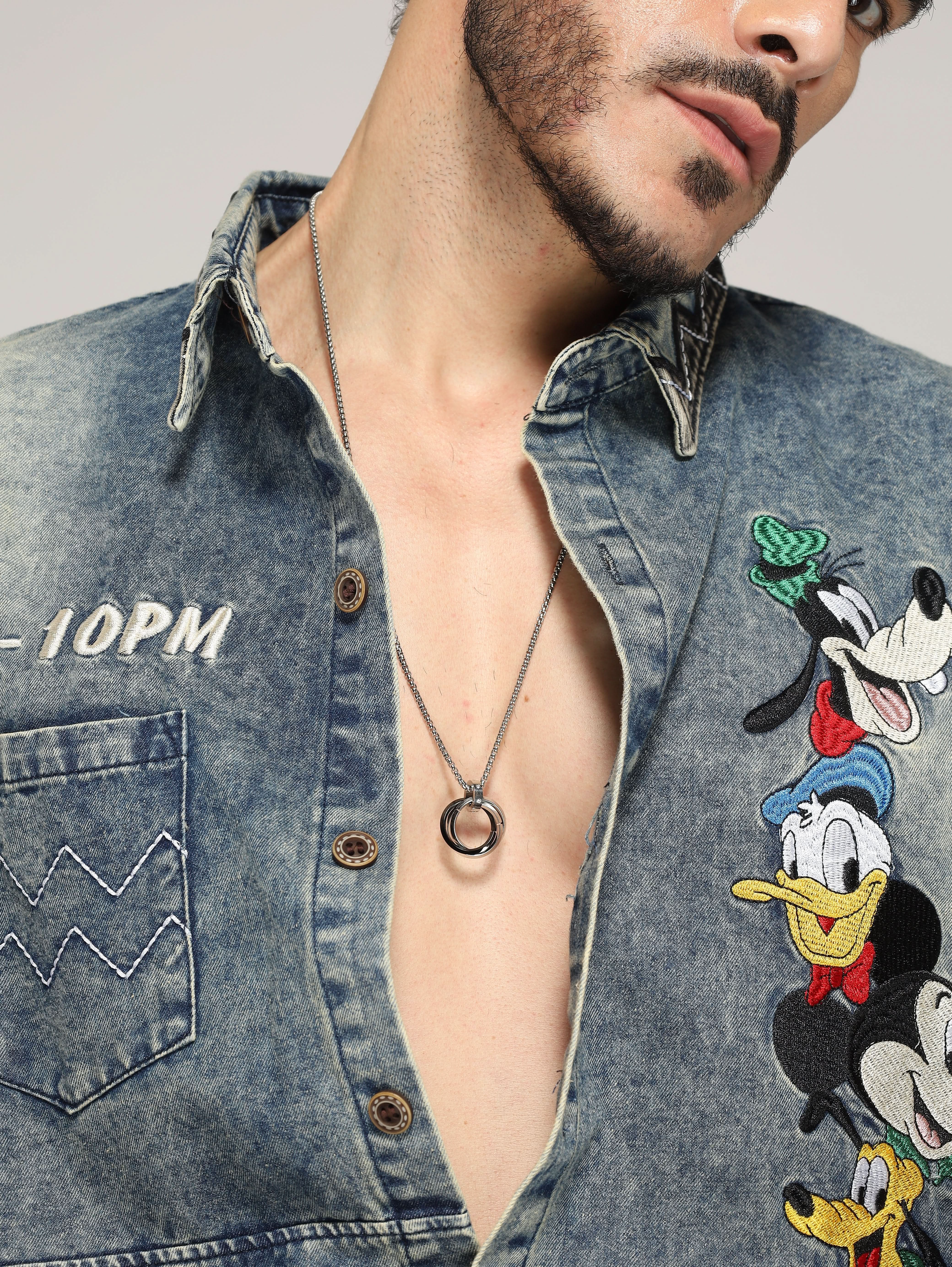Model wearing Three Rings Round Circle Pendant in black — men's black pendant styled on hand