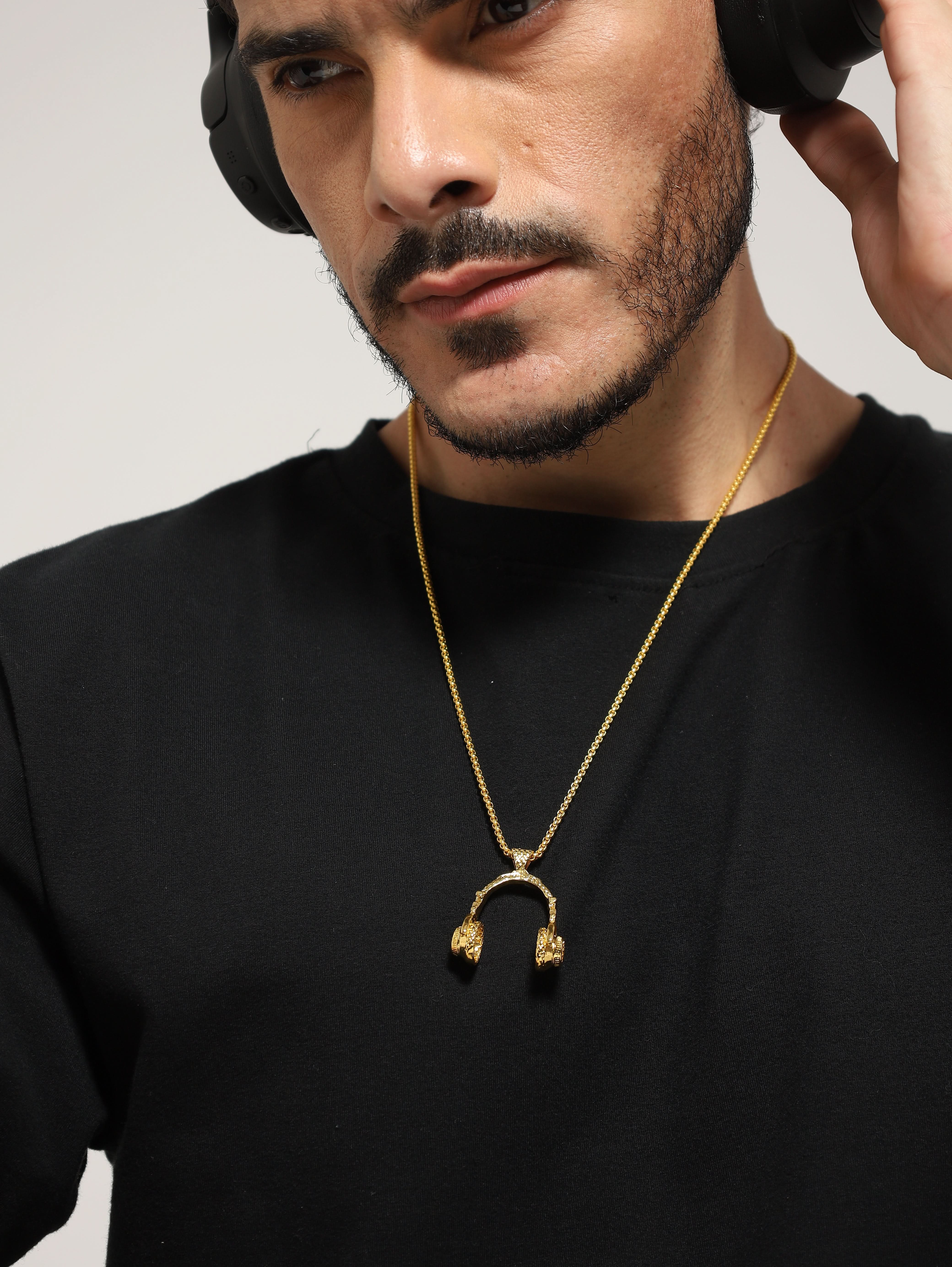 Model wearing DJ Music Phone Pendant in gold — men's gold pendant styled on hand