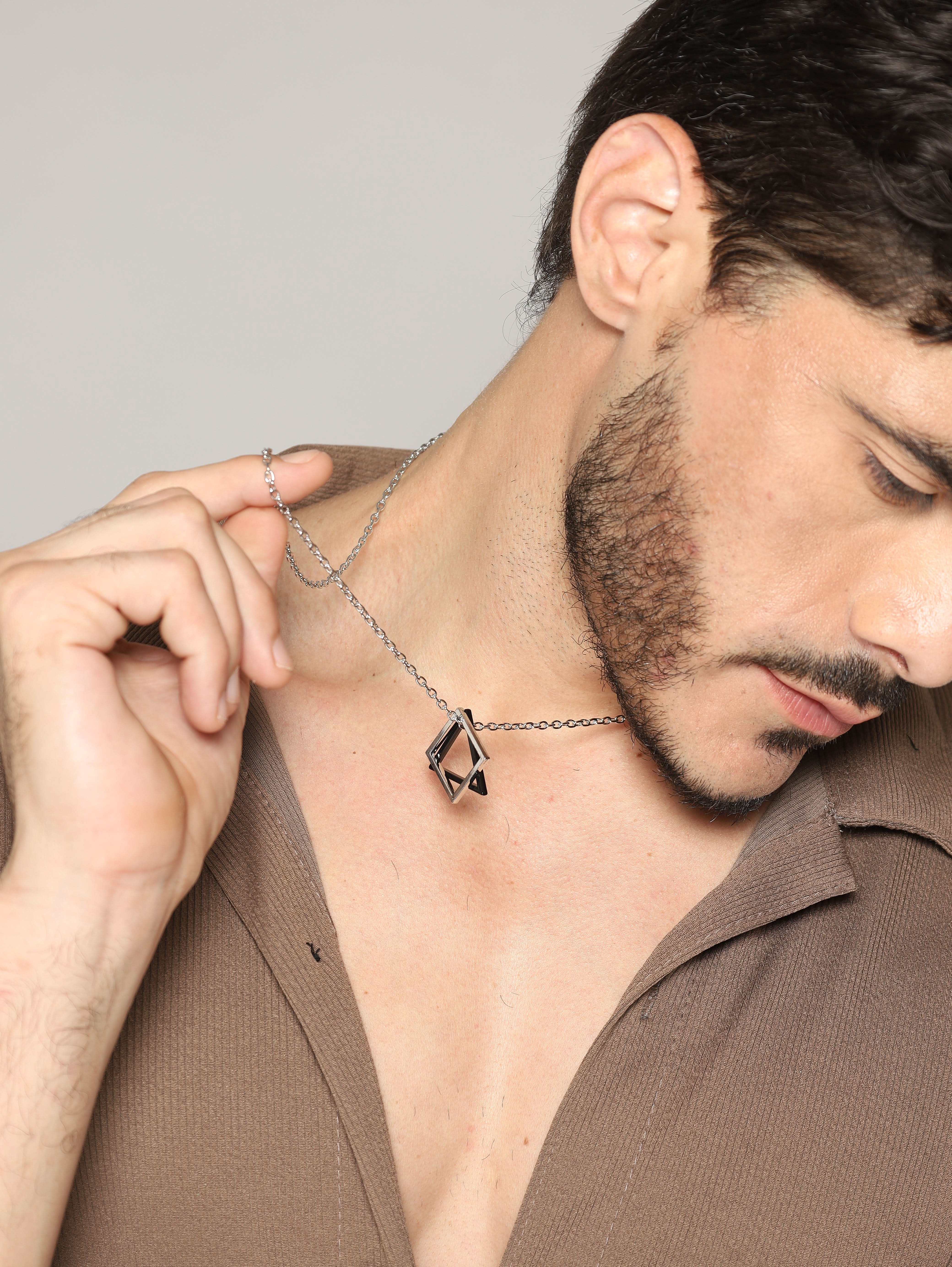 Model wearing Square Triangle Designer Pendant in black silver — men's black silver pendant styled on hand