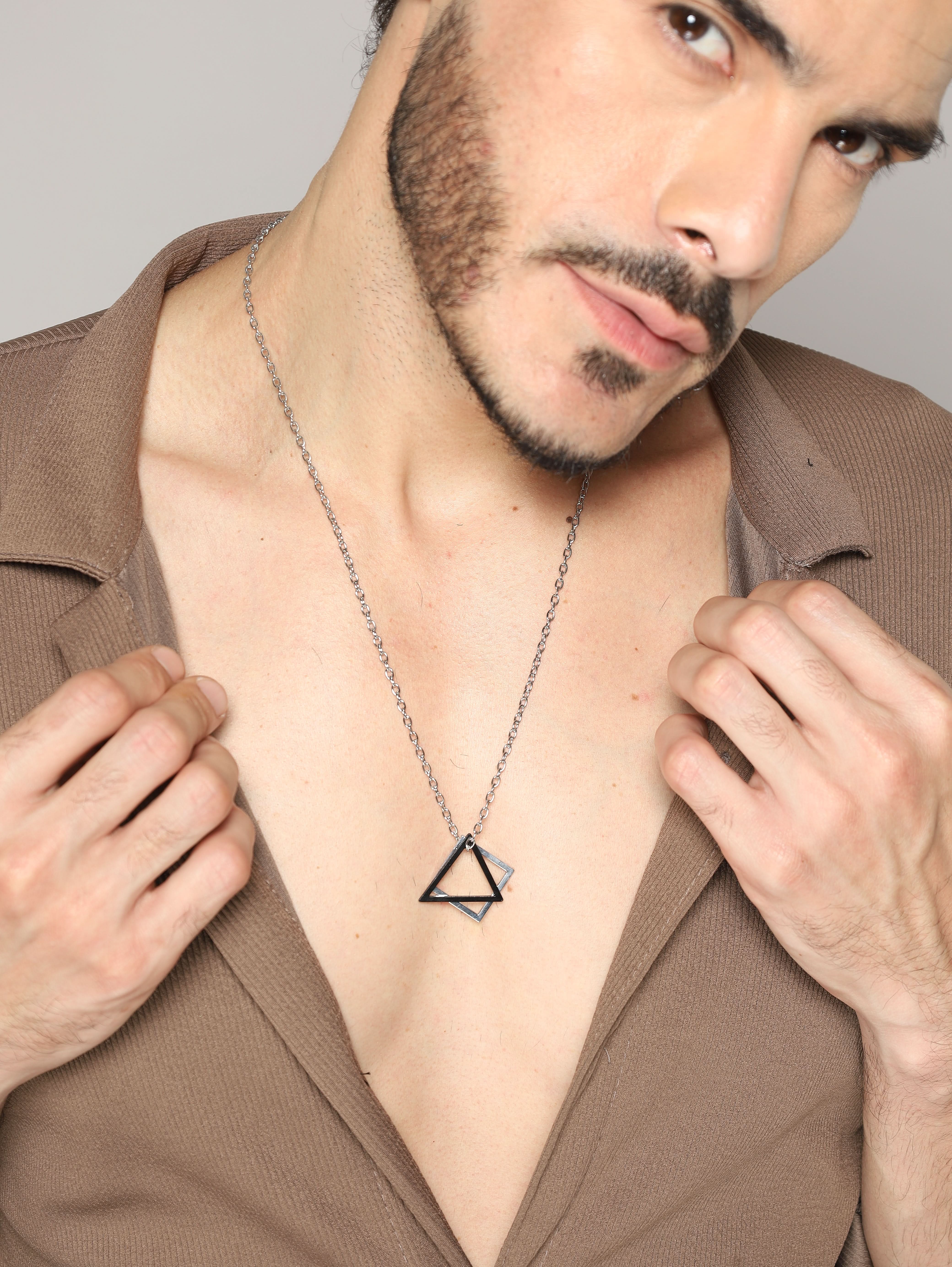Model wearing Square Triangle Designer Pendant in black silver — men's black silver pendant styled on hand