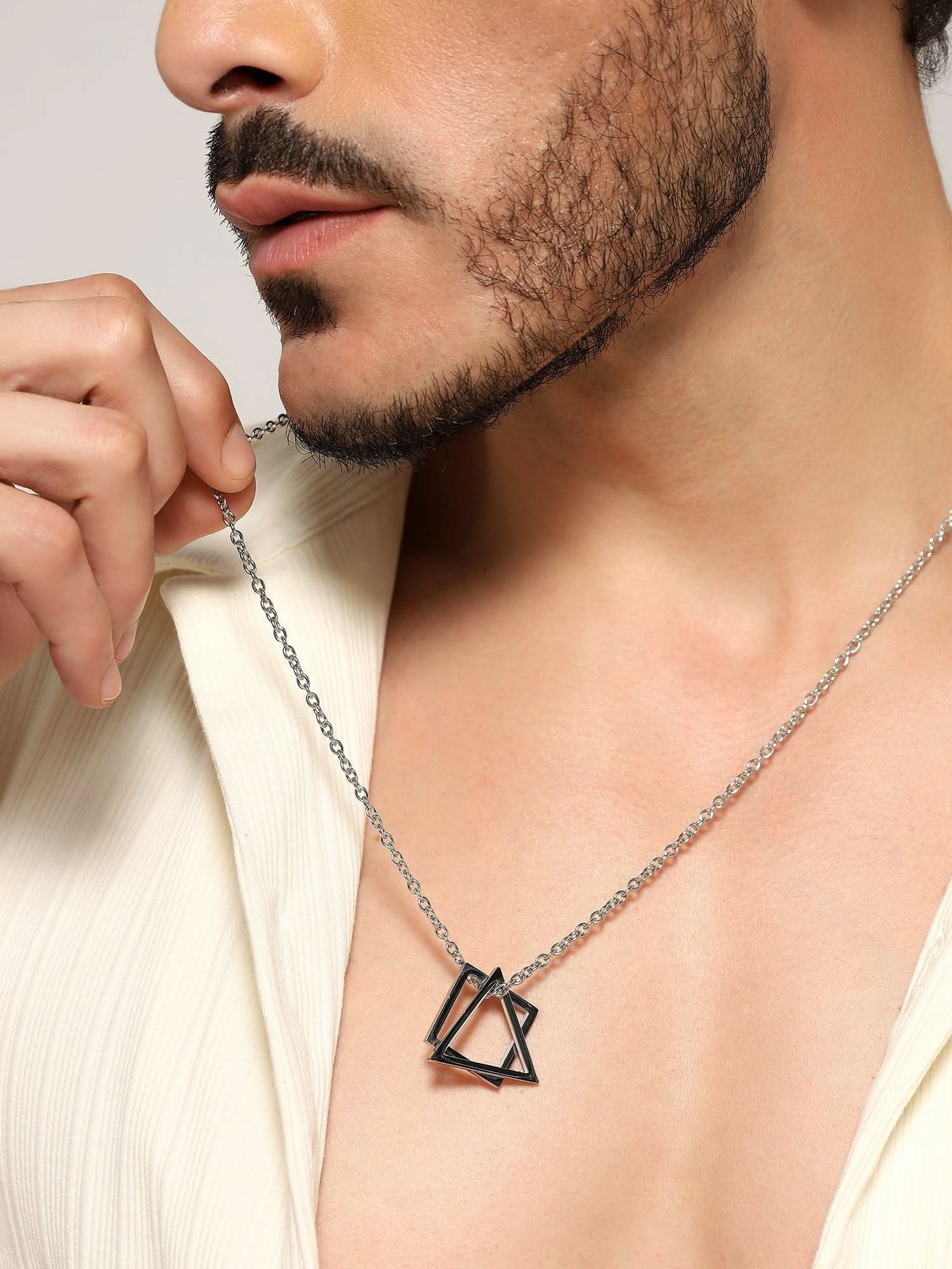 Model wearing Square Triangle Designer Pendant in silver — men's silver pendant styled on hand