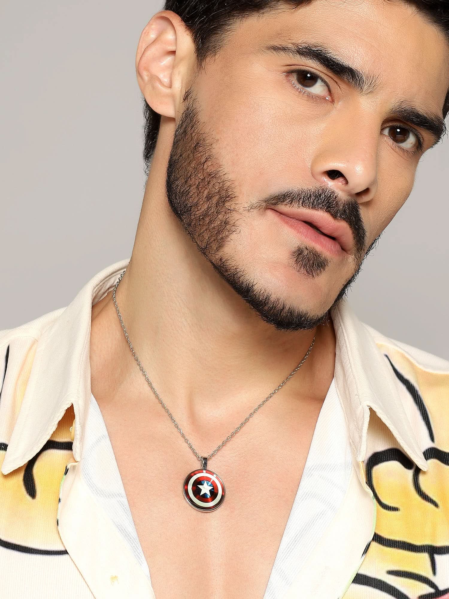 Model wearing Captain America Shield Pendant — men's pendant styled on hand