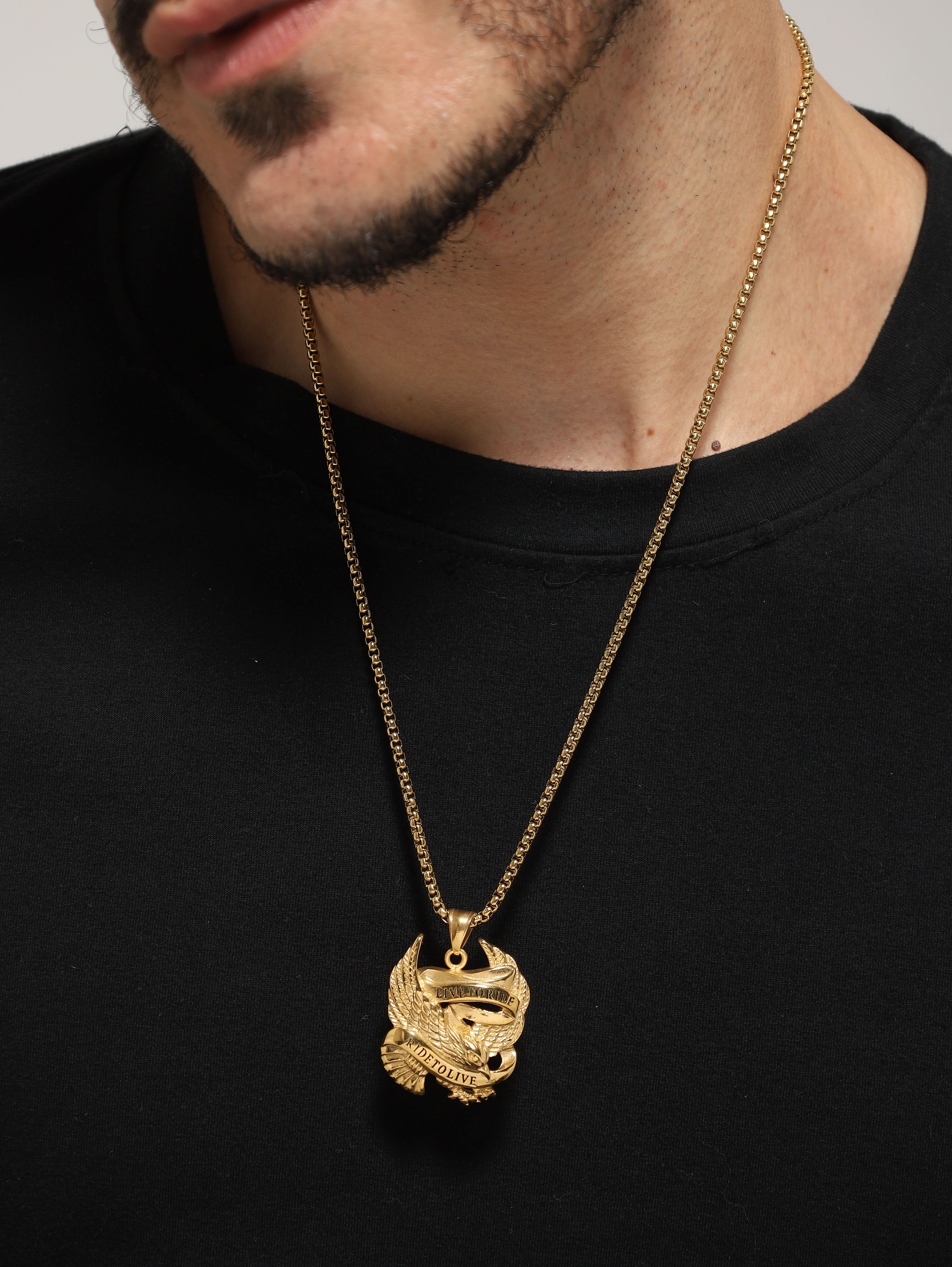 Model wearing Biker Spirit Rider Pendant in gold — men's gold pendant styled on hand
