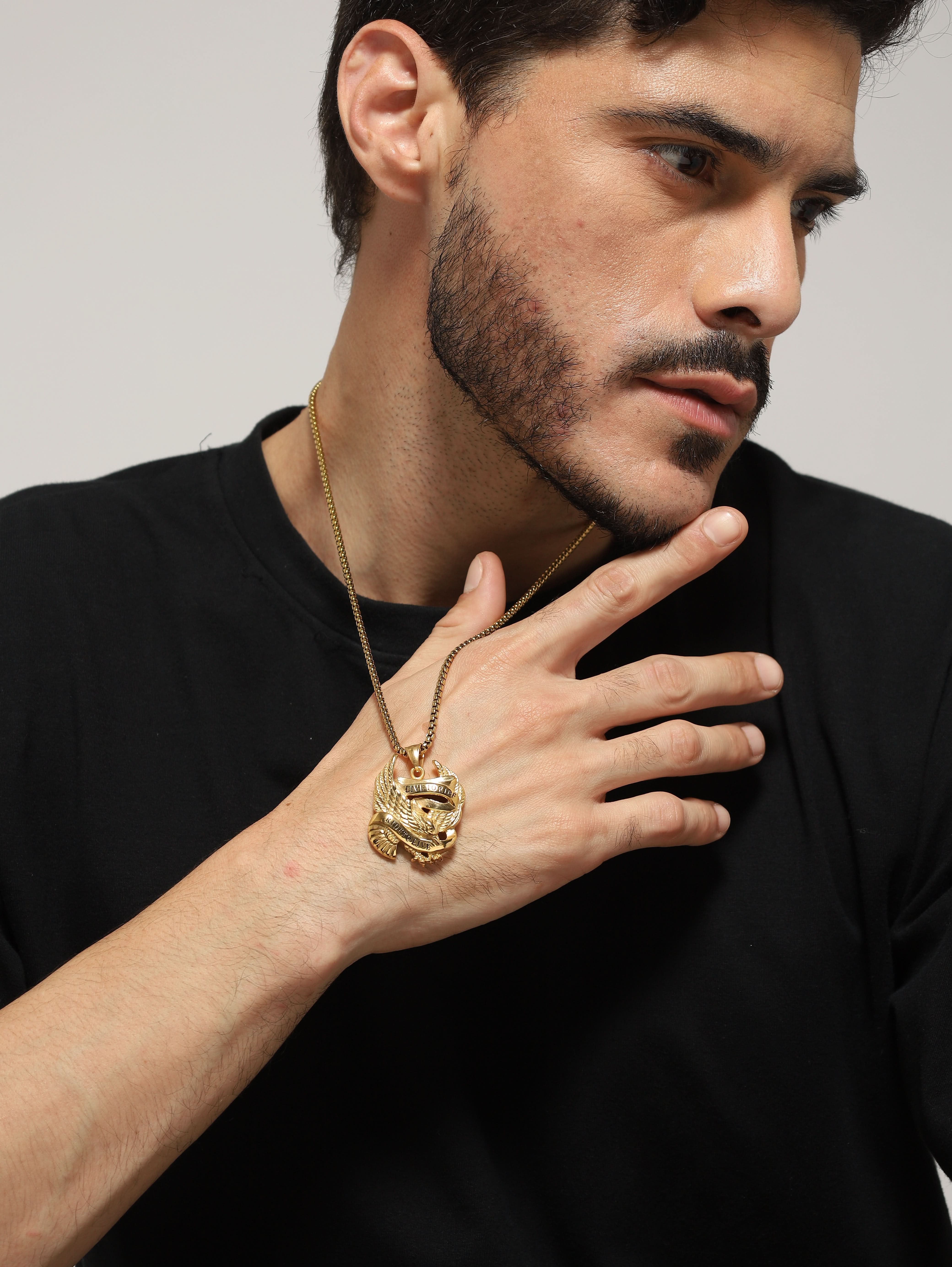 Model wearing Biker Spirit Rider Pendant in gold — men's gold pendant styled on hand