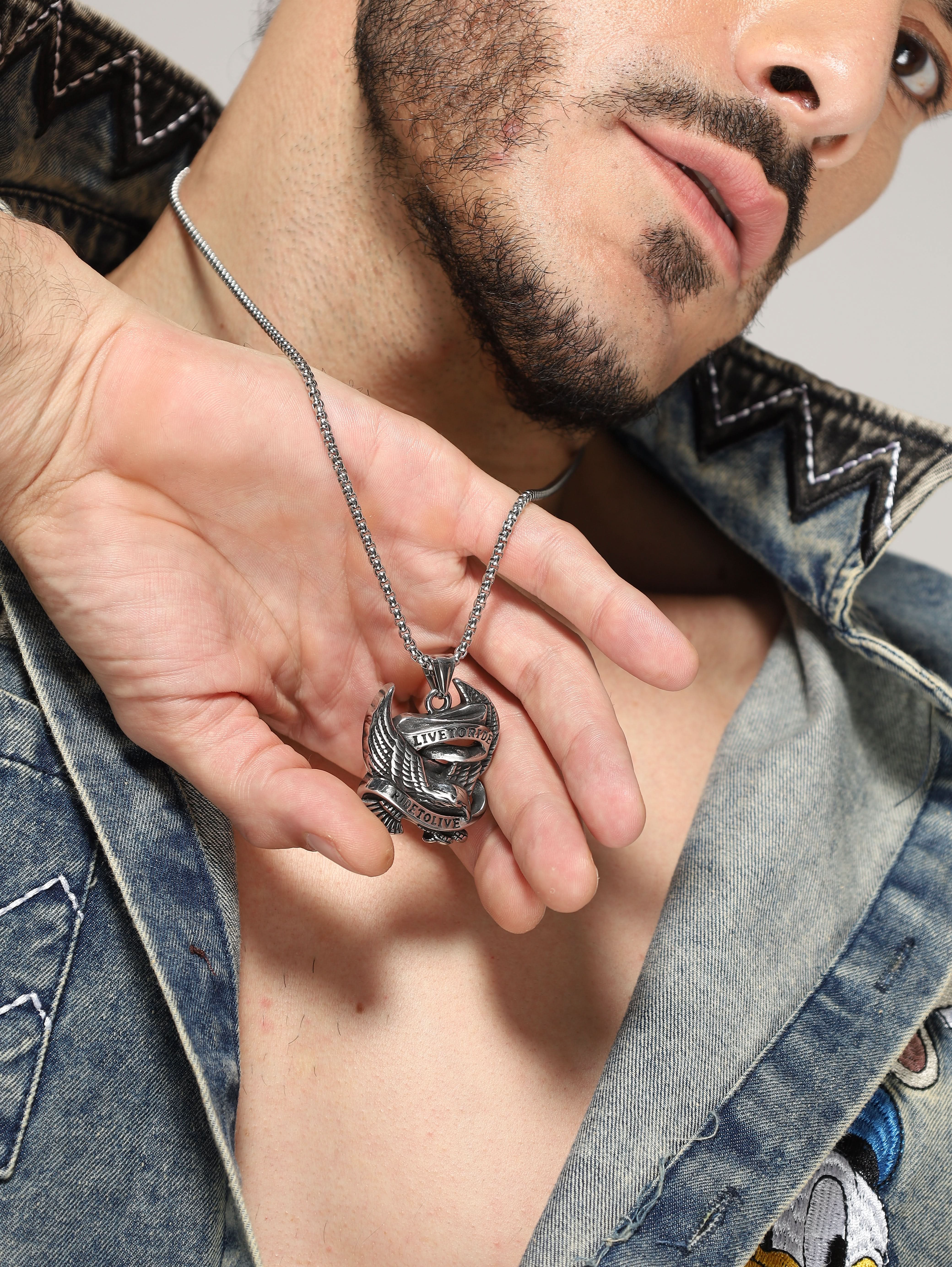 Model wearing Biker Spirit Rider Pendant in silver — men's silver pendant styled on hand