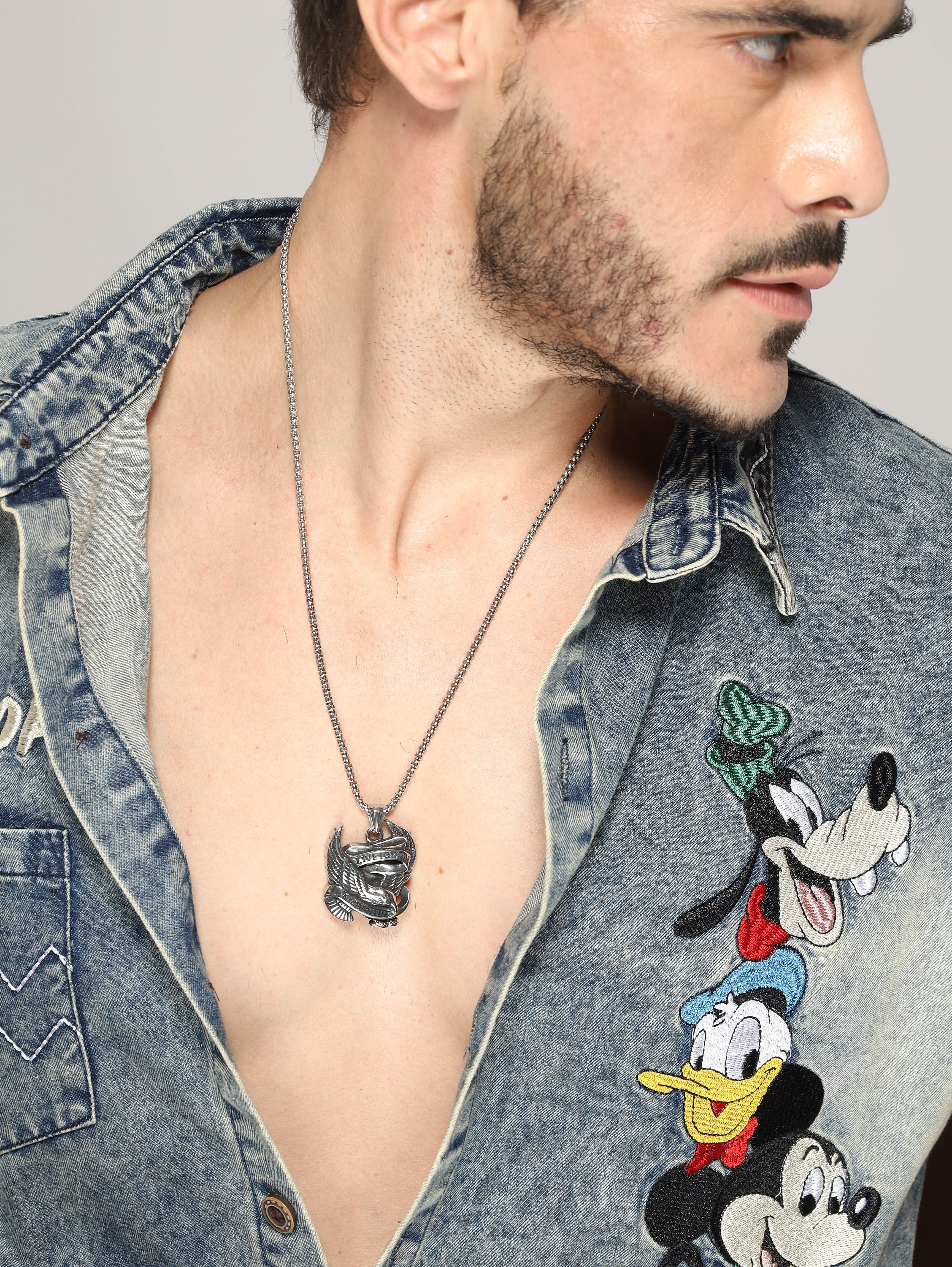 Model wearing Biker Spirit Rider Pendant in silver — men's silver pendant styled on hand