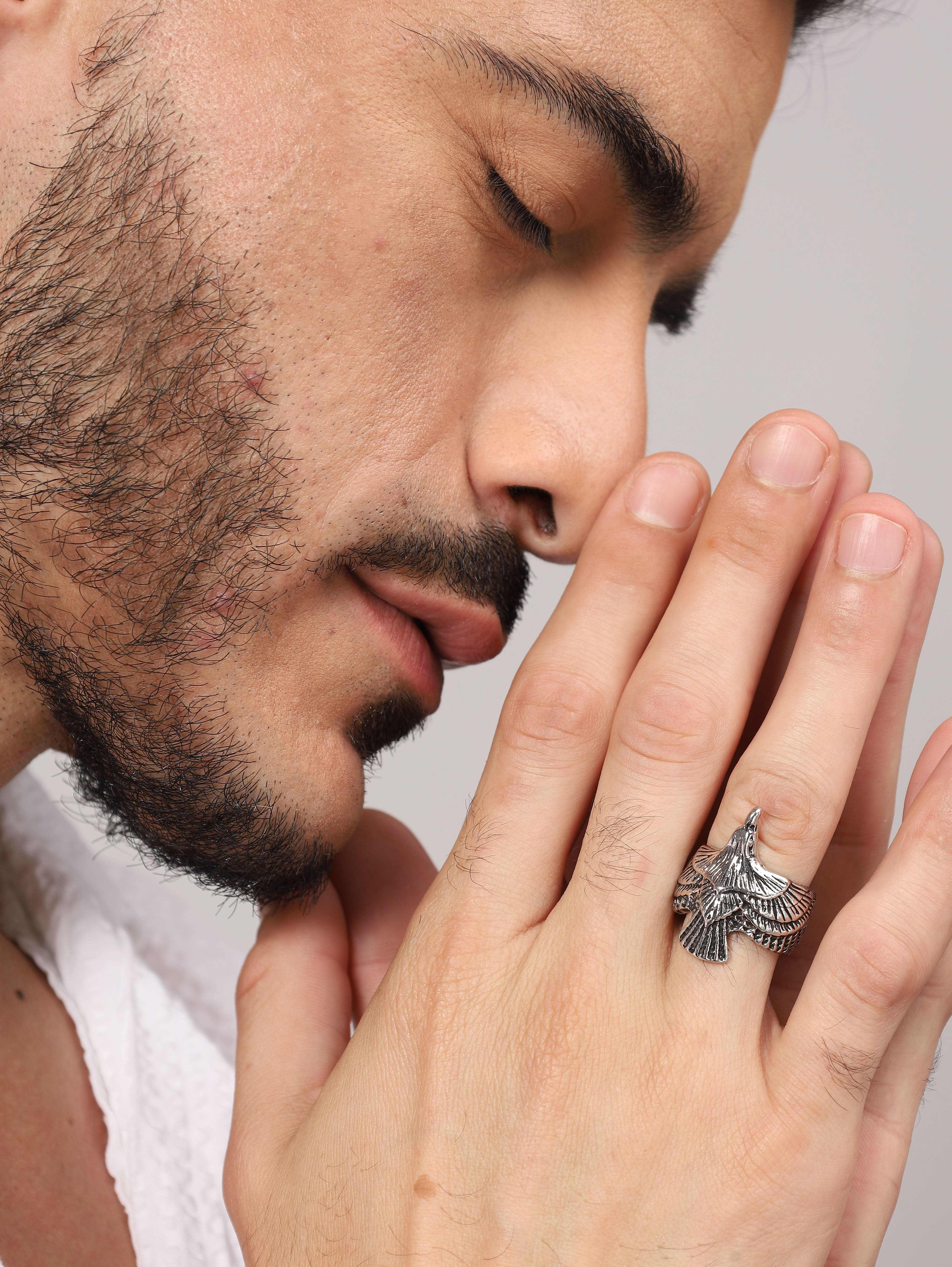 Model wearing Punk Eagle Ring in silver — men's silver ring styled on hand