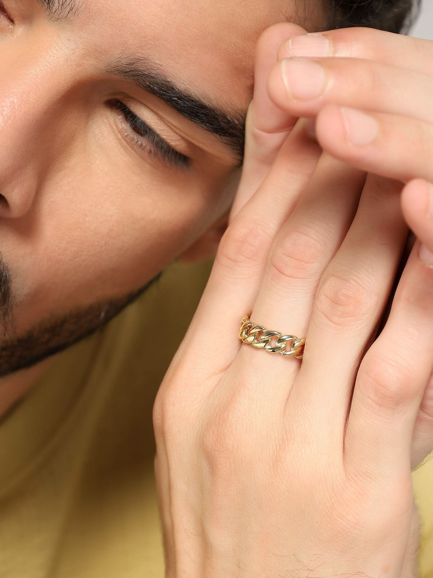 Model wearing Cuban Link Finger Ring in gold — men's gold ring styled on hand