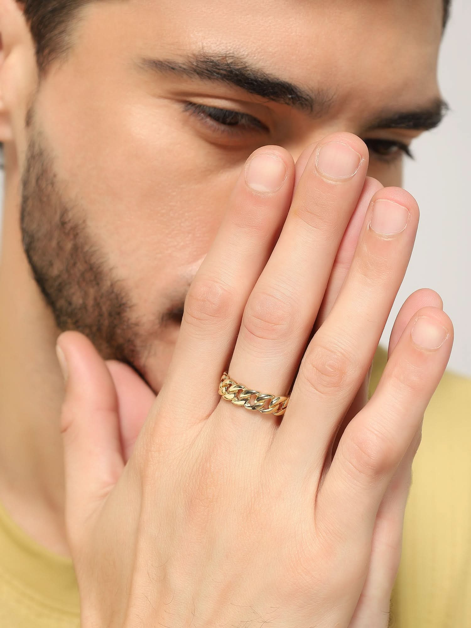 Model wearing Cuban Link Finger Ring in gold — men's gold ring styled on hand