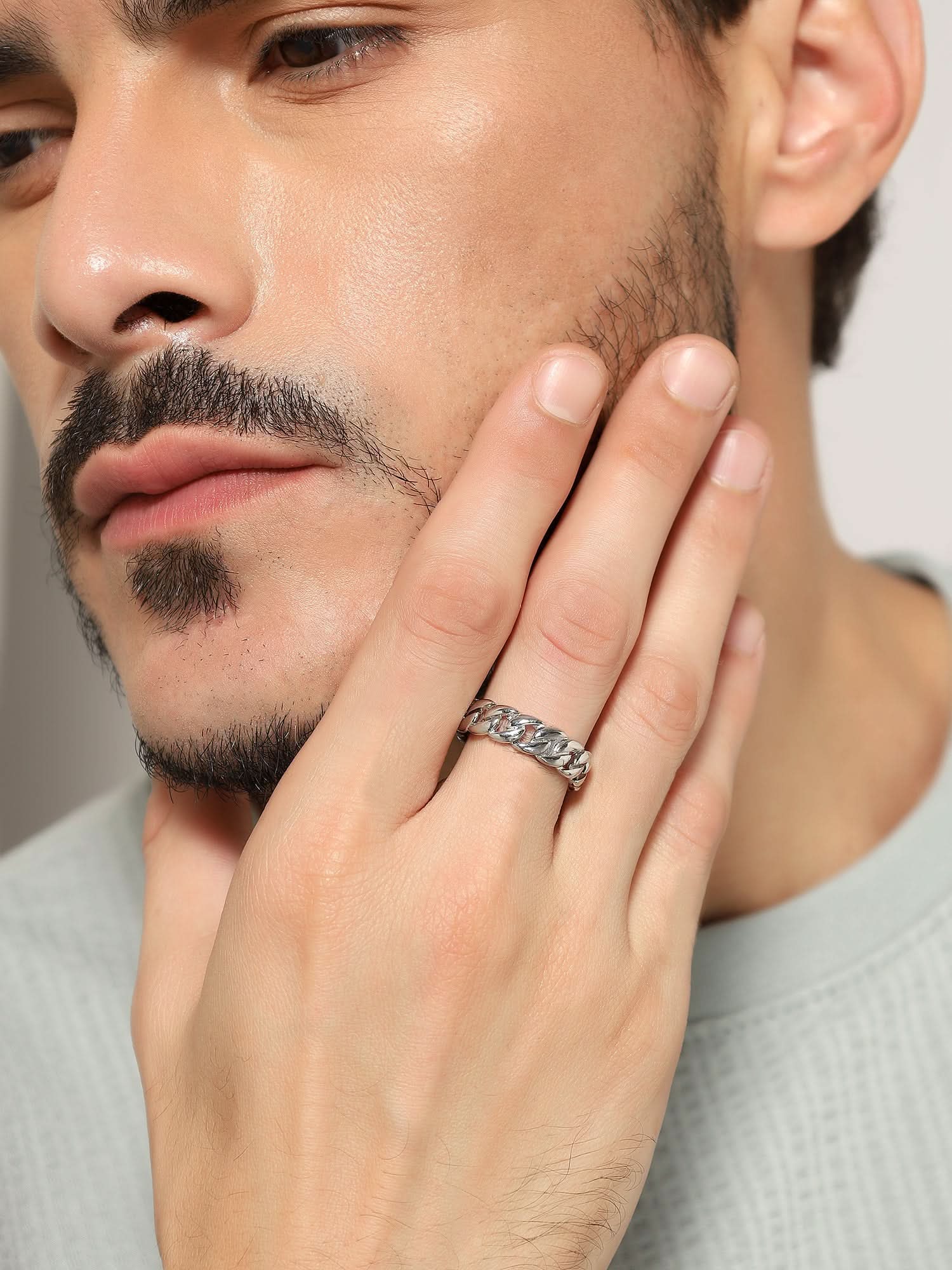 Model wearing Cuban Link Finger Ring in silver — men's silver ring styled on hand