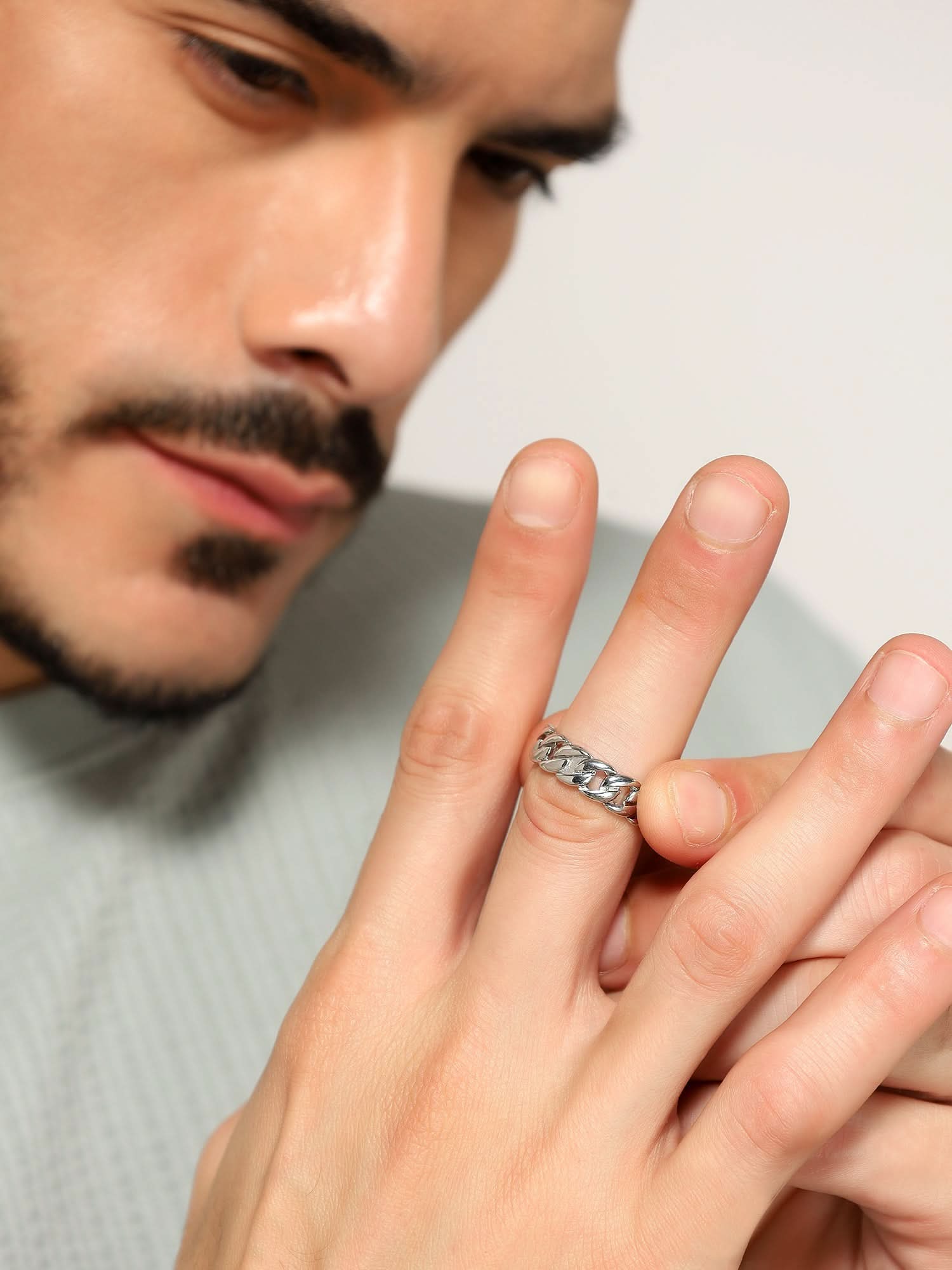 Model wearing Cuban Link Finger Ring in silver — men's silver ring styled on hand