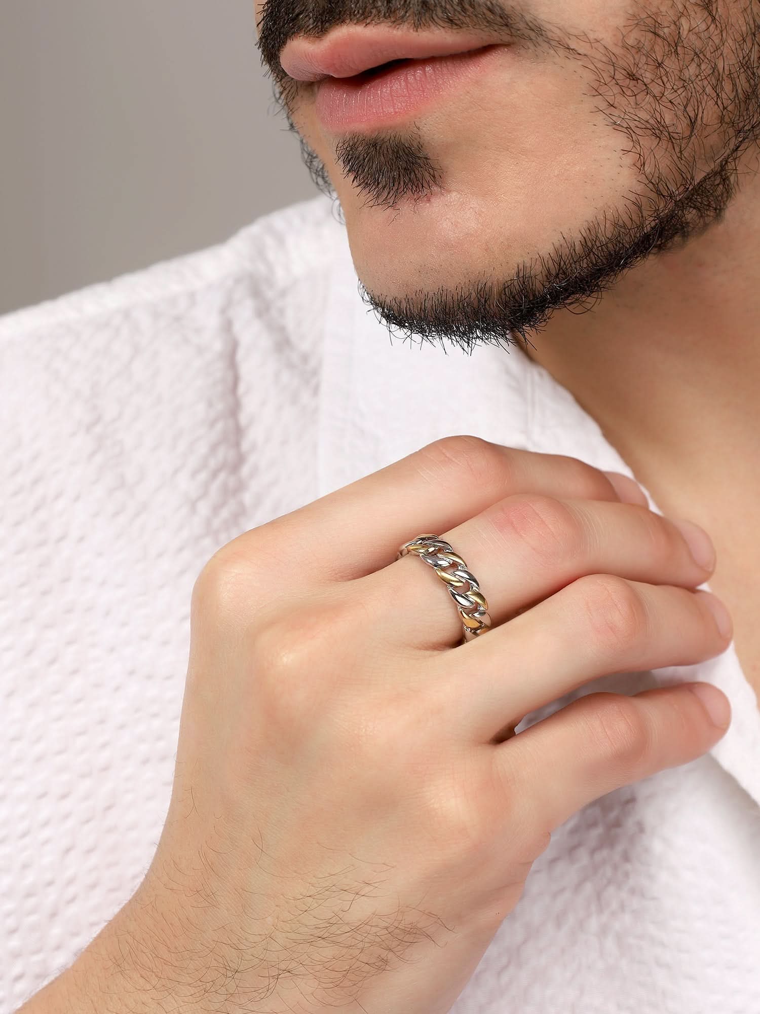 Model wearing Cuban Link Finger Ring in silver gold — men's silver gold ring styled on hand