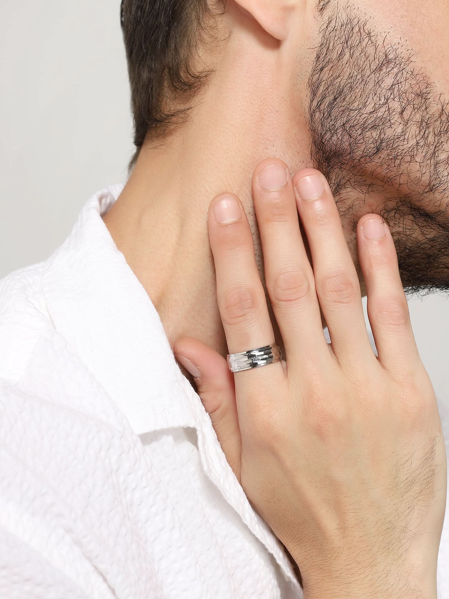 Model wearing Honeycomb Pattern Ring in silver — men's silver ring styled on hand