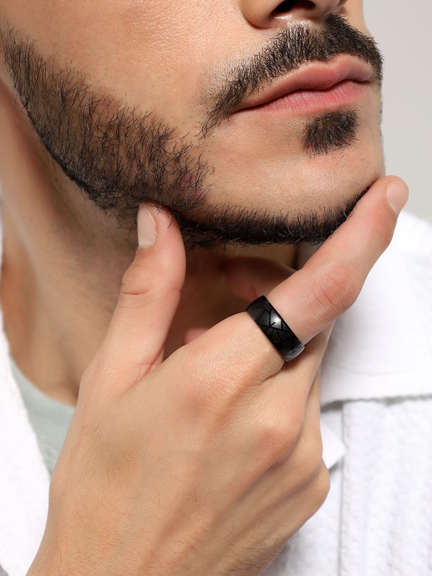 Model wearing Crackle Pattern Ring in black — men's black ring styled on hand