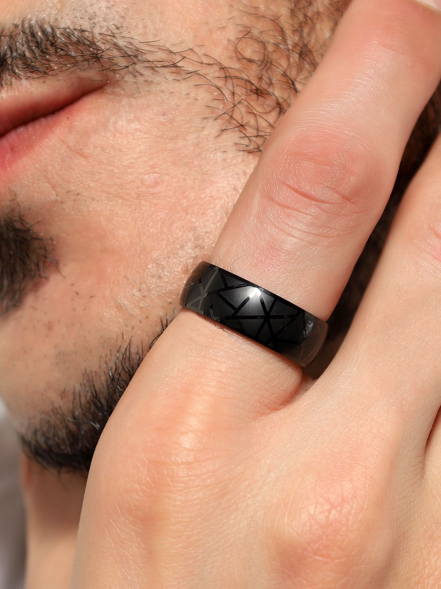 Model wearing Crackle Pattern Ring in black — men's black ring styled on hand