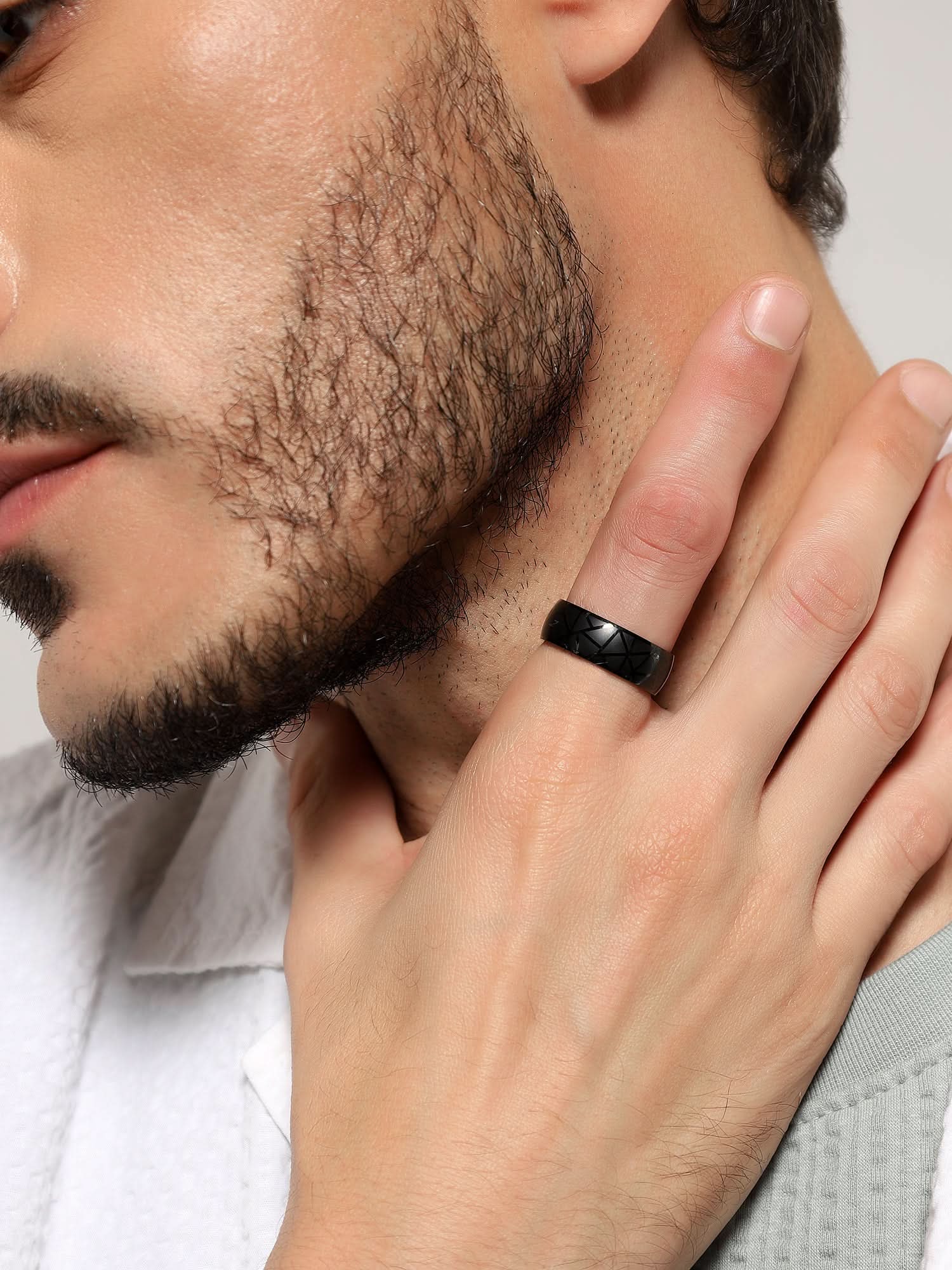 Model wearing Crackle Pattern Ring in black — men's black ring styled on hand