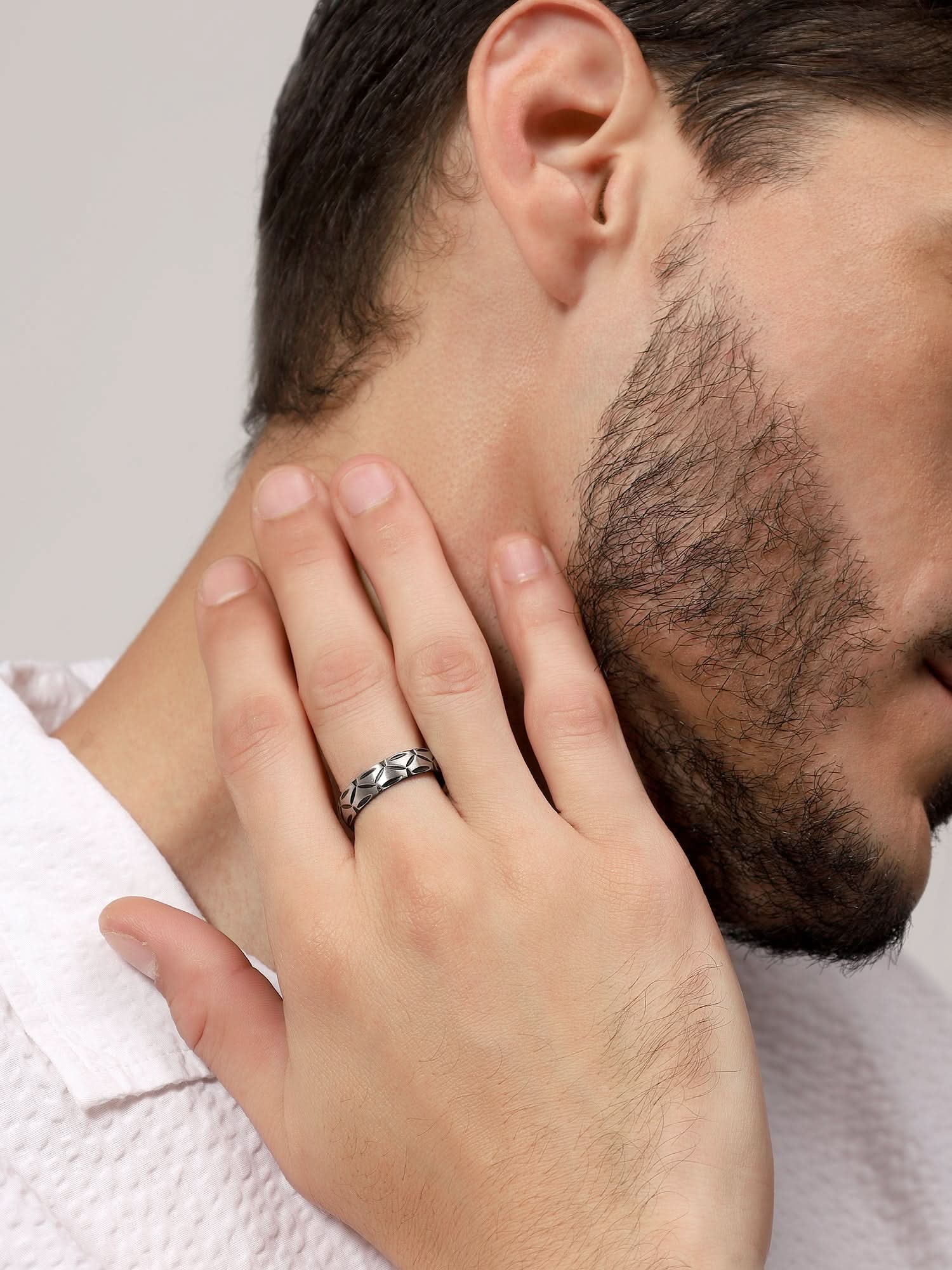 Model wearing Matte Band Groove Ring in silver — men's silver ring styled on hand