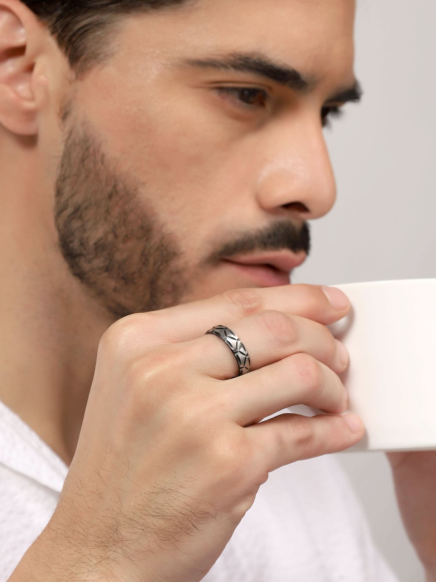 Model wearing Matte Band Groove Ring in silver — men's silver ring styled on hand