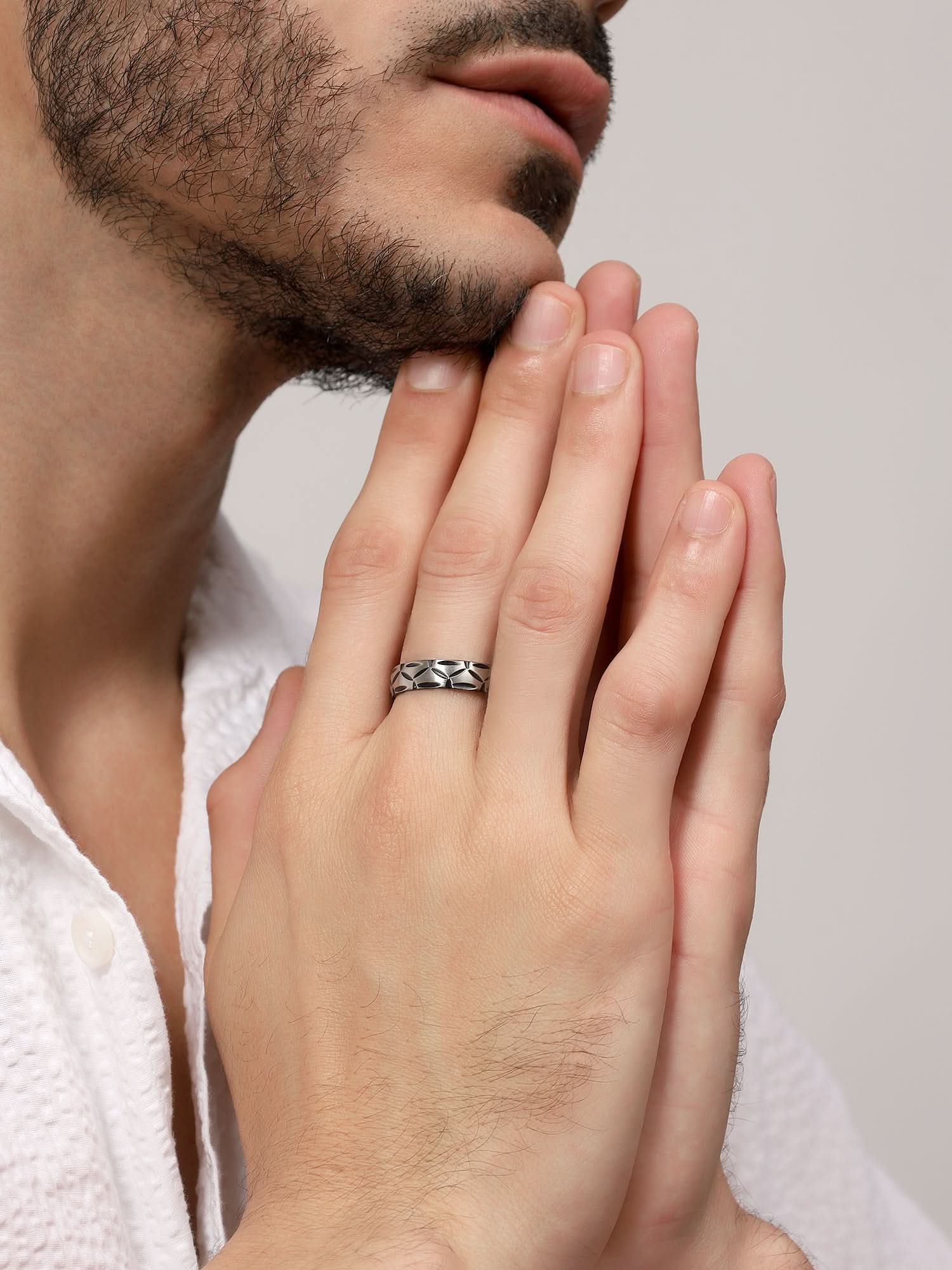 Model wearing Matte Band Groove Ring in silver — men's silver ring styled on hand