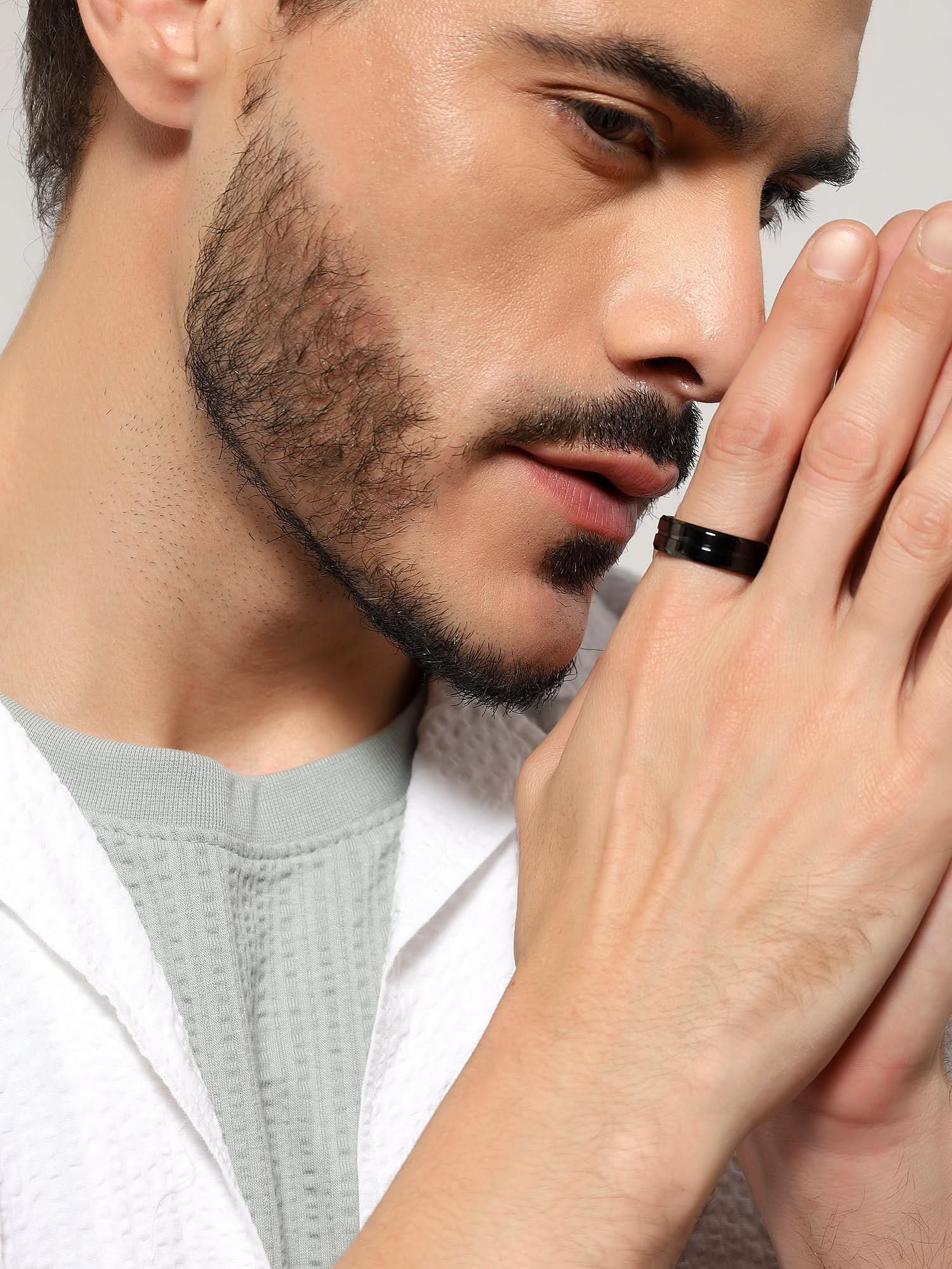 Model wearing Single Slot Ring in black — men's black ring styled on hand