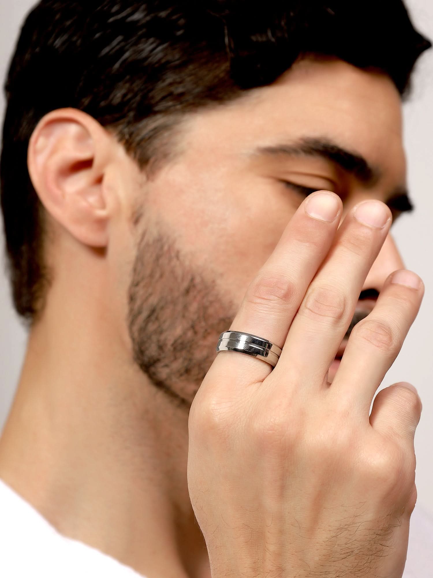 Model wearing Single Slot Ring in silver — men's silver ring styled on hand