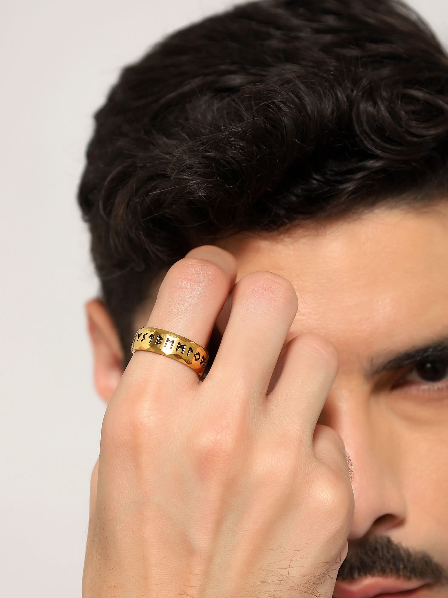 Model wearing Ancient Retro Ring in gold — men's gold ring styled on hand