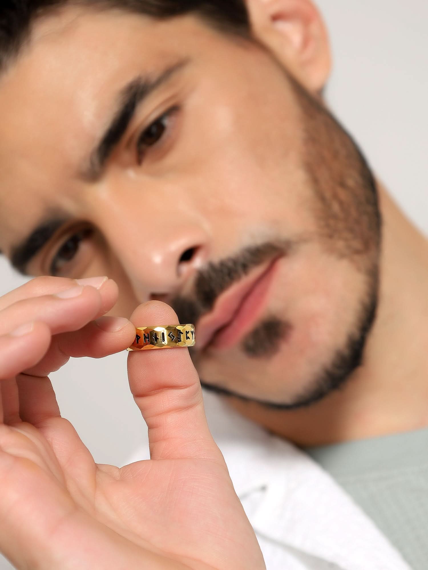 Model wearing Ancient Retro Ring in gold — men's gold ring styled on hand