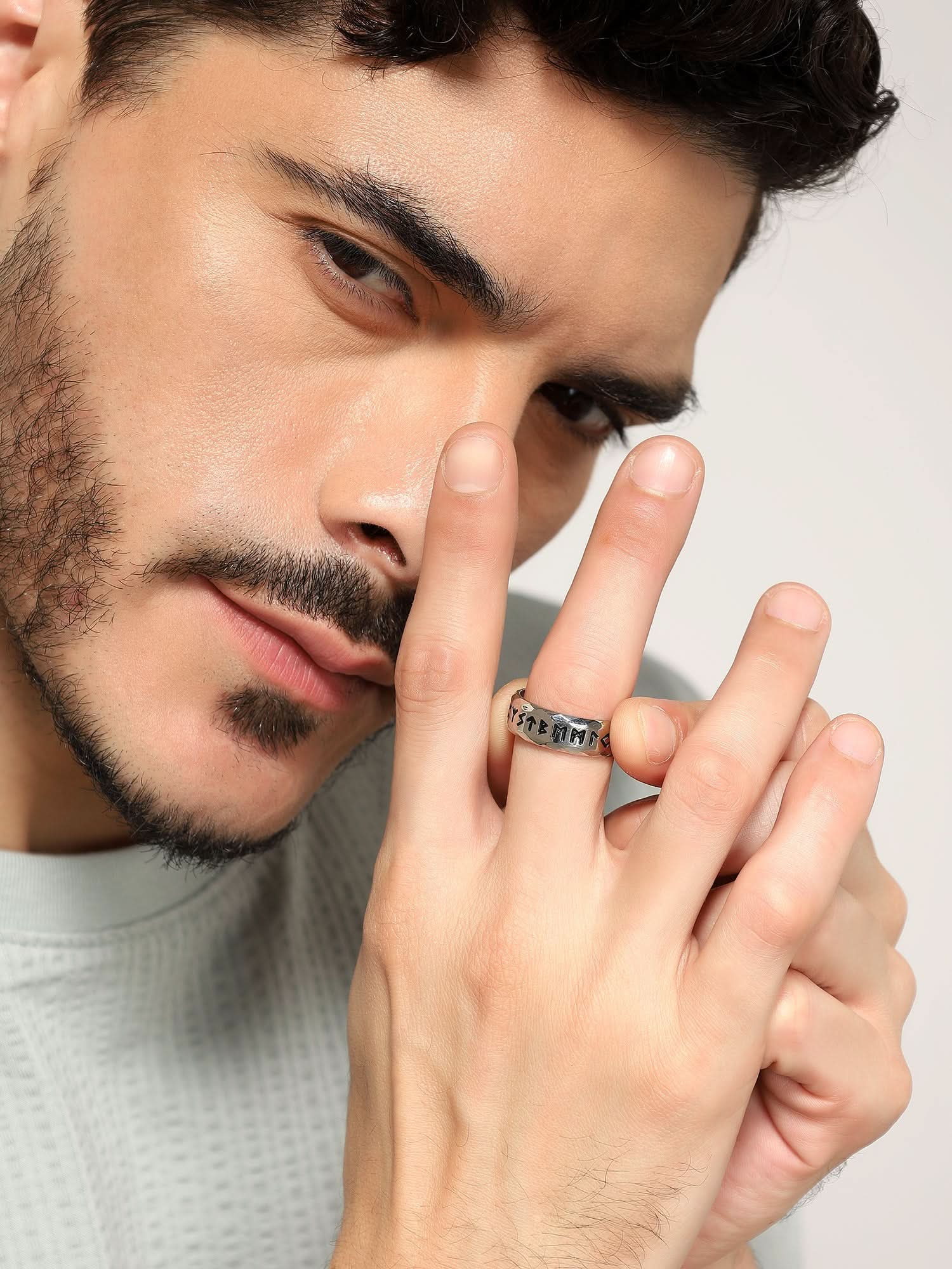 Model wearing Ancient Retro Ring in silver — men's silver ring styled on hand