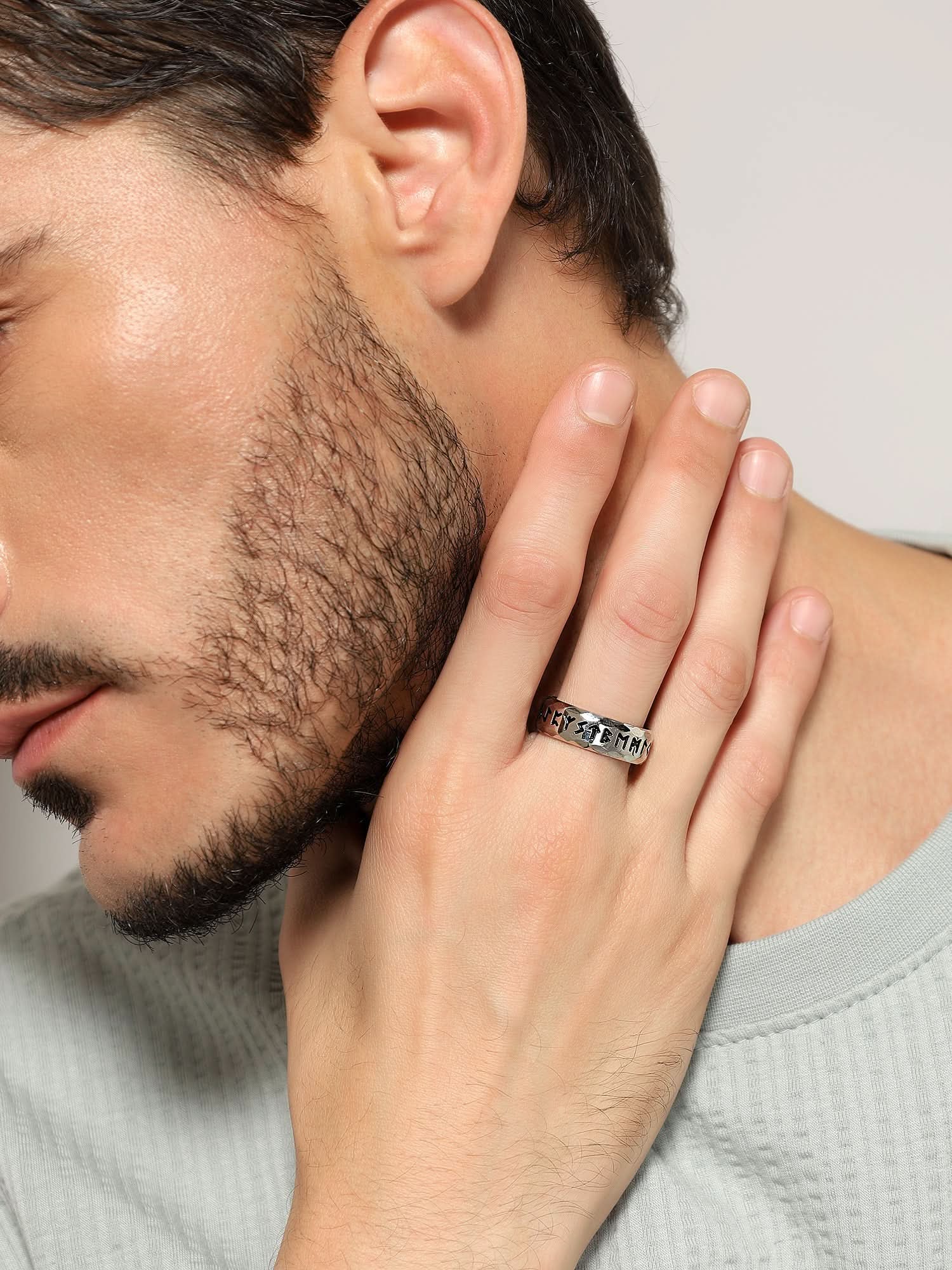 Model wearing Ancient Retro Ring in silver — men's silver ring styled on hand