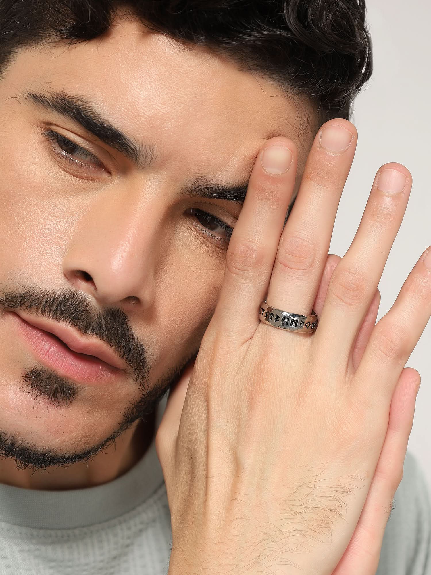 Model wearing Ancient Retro Ring in silver — men's silver ring styled on hand