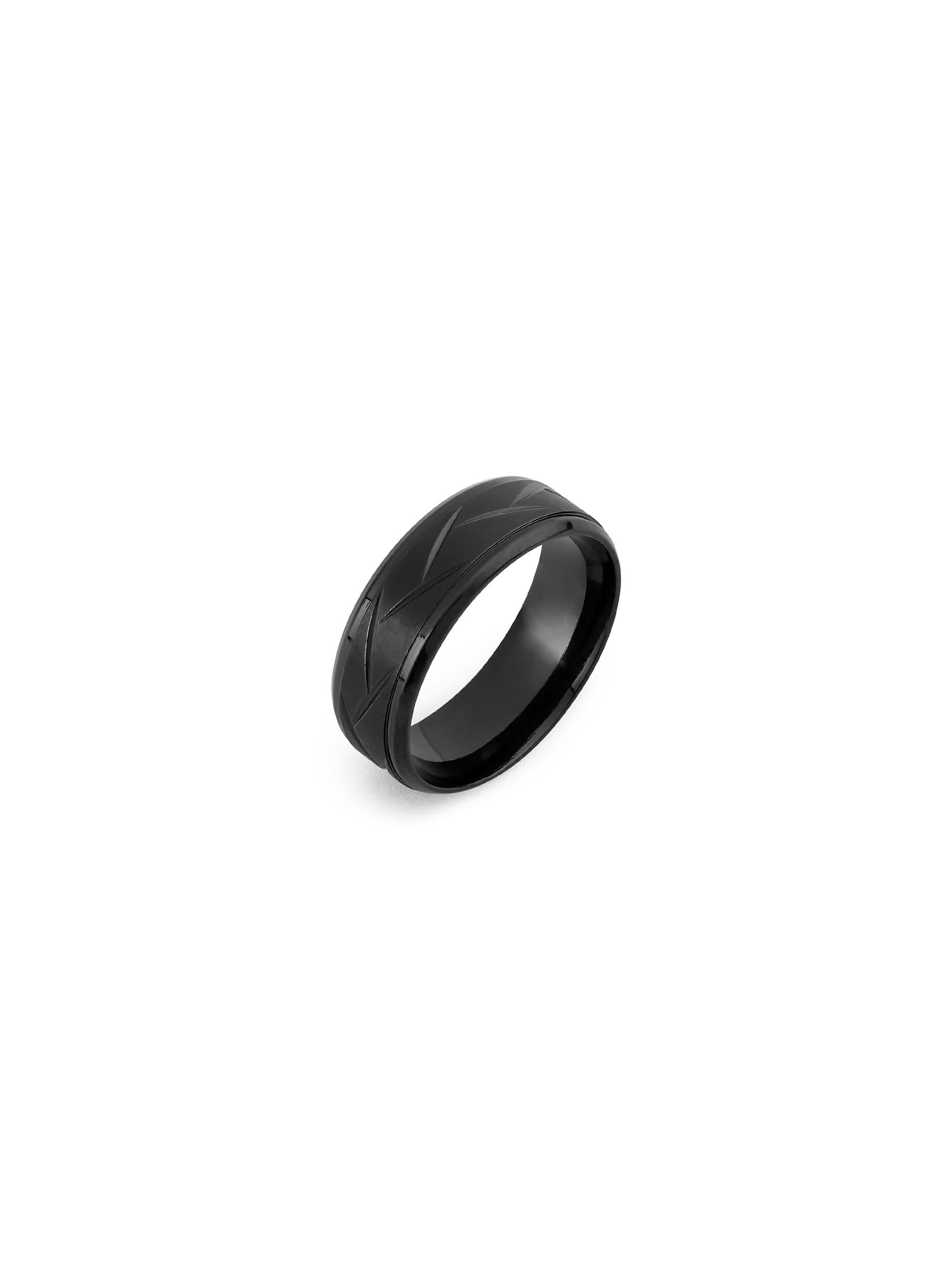 Black ring with a textured design on a white background