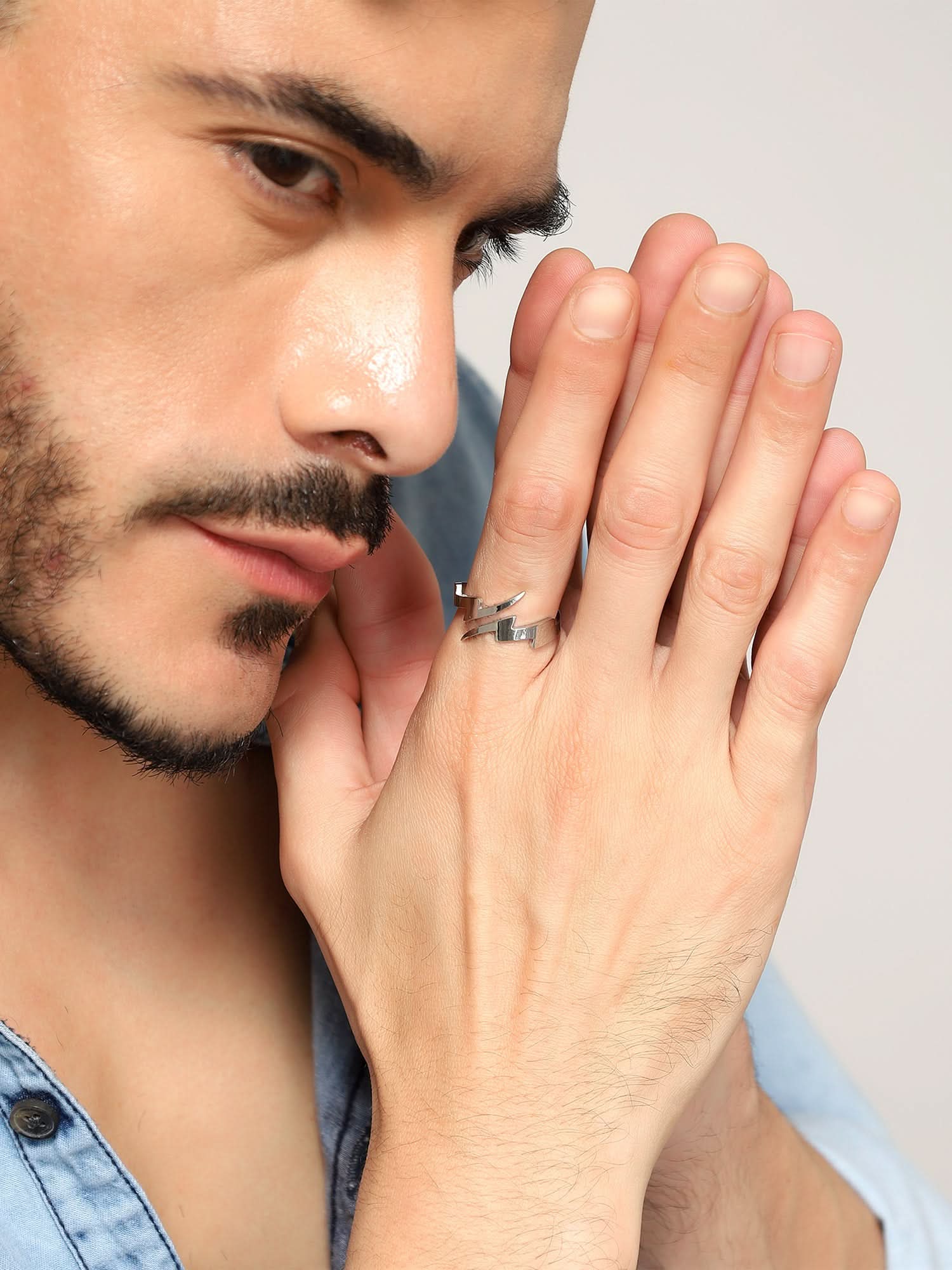Model wearing Lightning Split Ring in silver — men's silver ring styled on hand