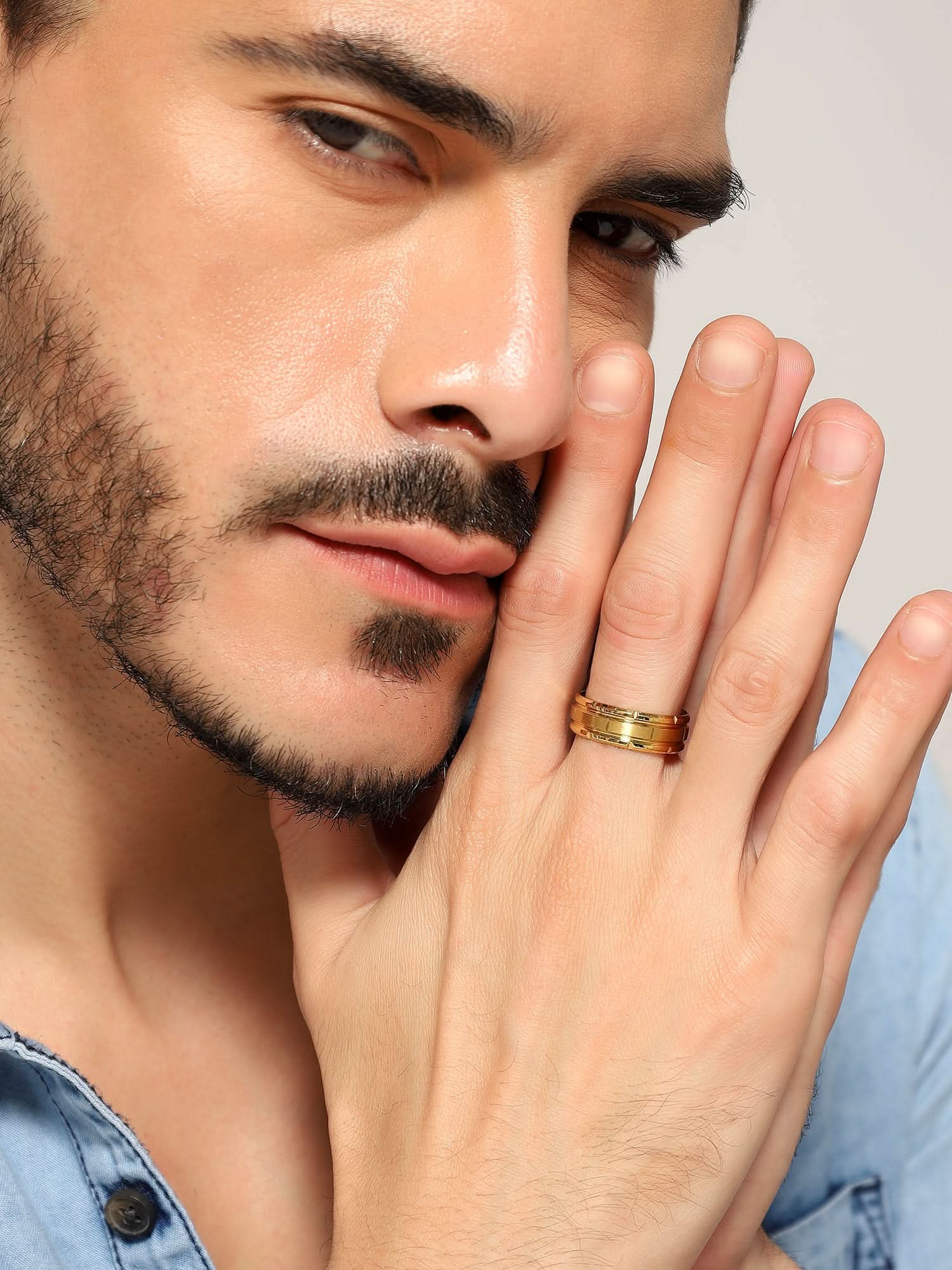 Model wearing Tungsten Pattern Ring in gold — men's gold ring styled on hand