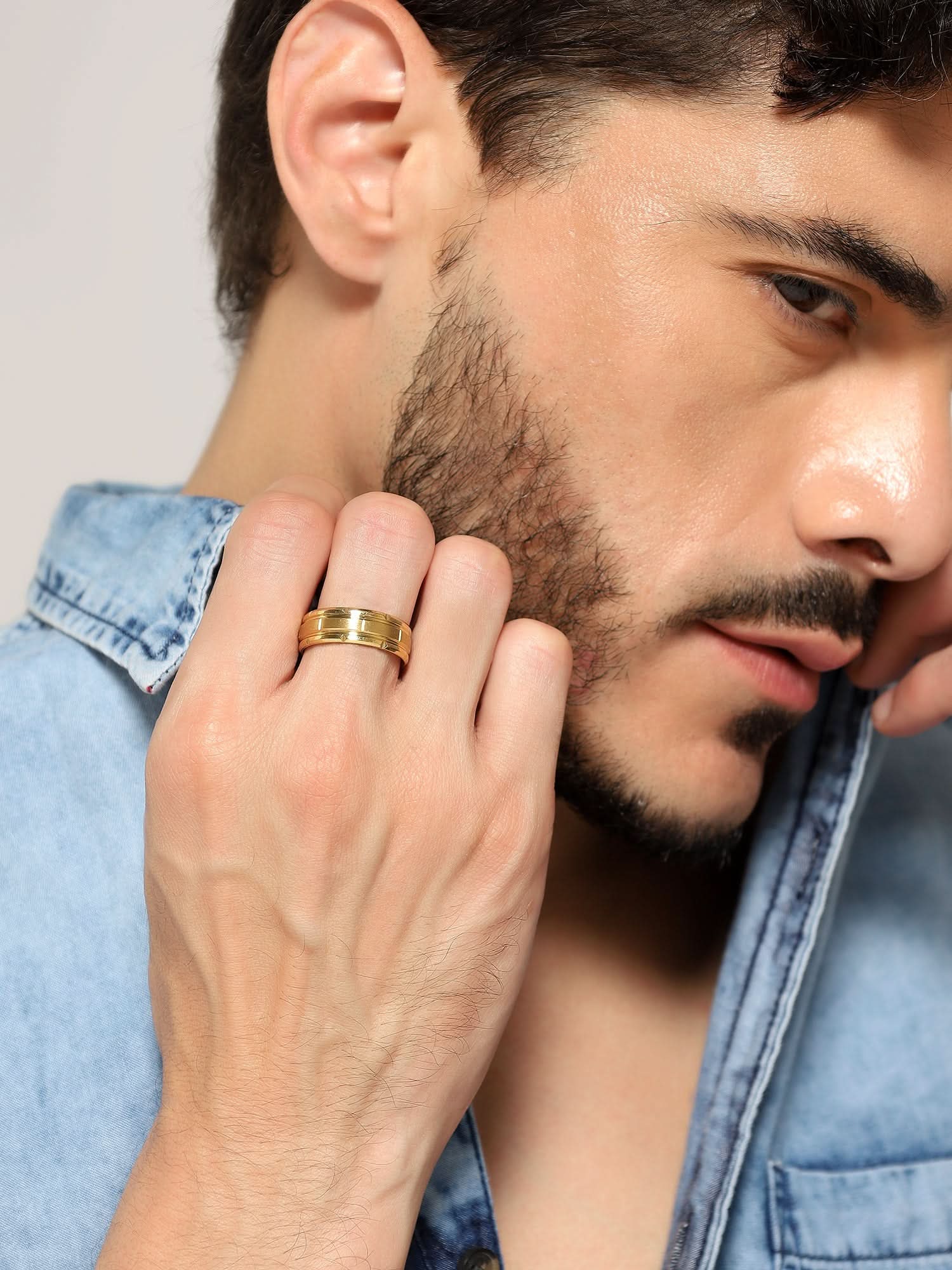 Model wearing Tungsten Pattern Ring in gold — men's gold ring styled on hand
