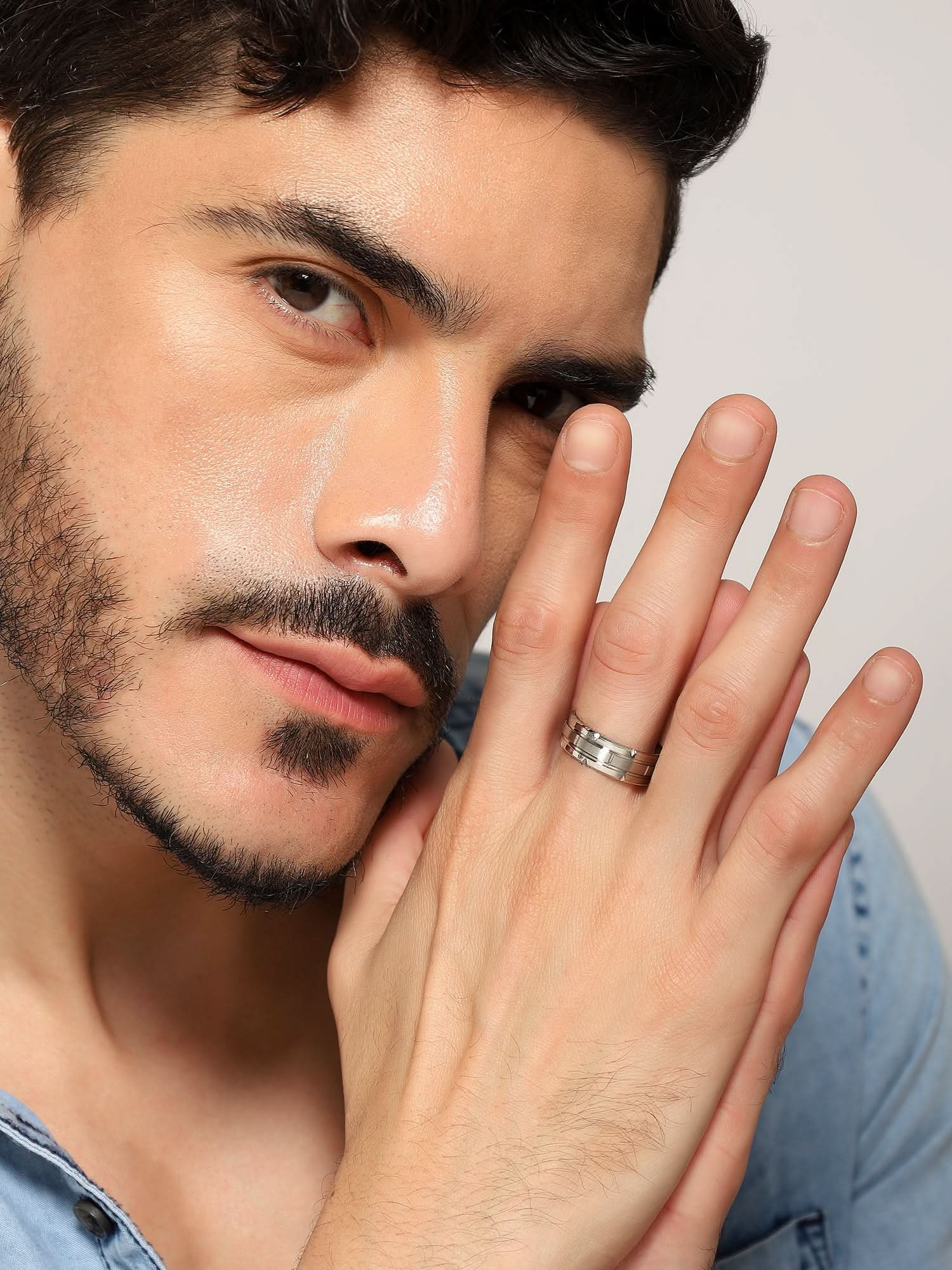 Model wearing Tungsten Pattern Ring in silver — men's silver ring styled on hand
