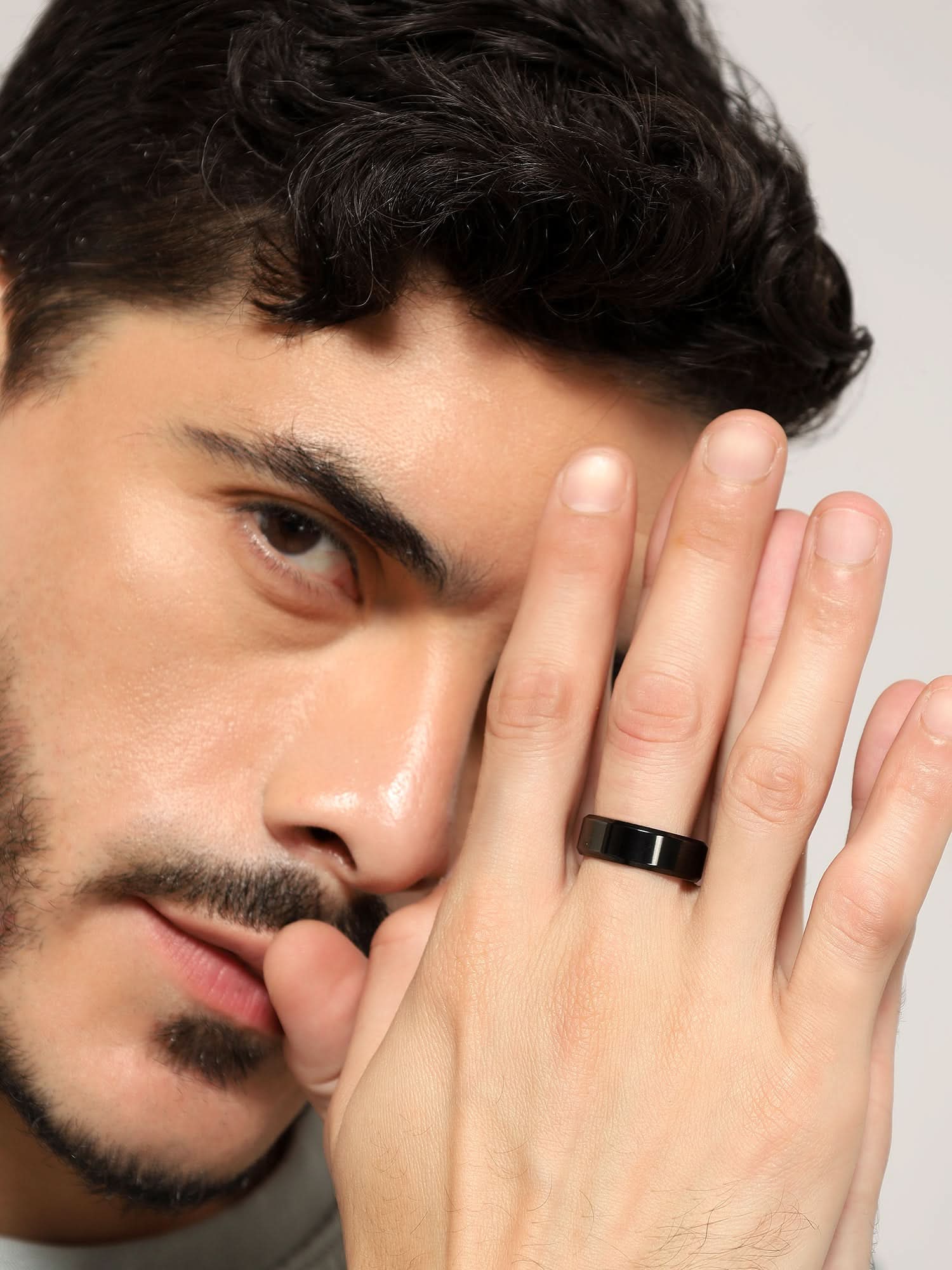 Model wearing Rectangle Signet Ring in black — men's black ring styled on hand