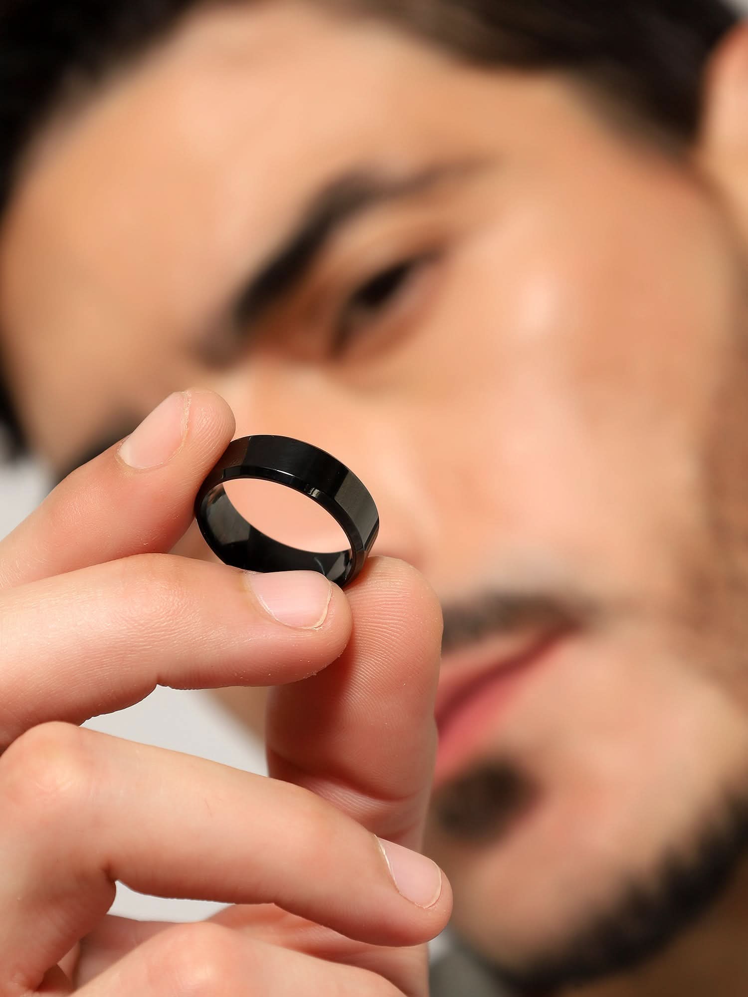 Model wearing Rectangle Signet Ring in black — men's black ring styled on hand