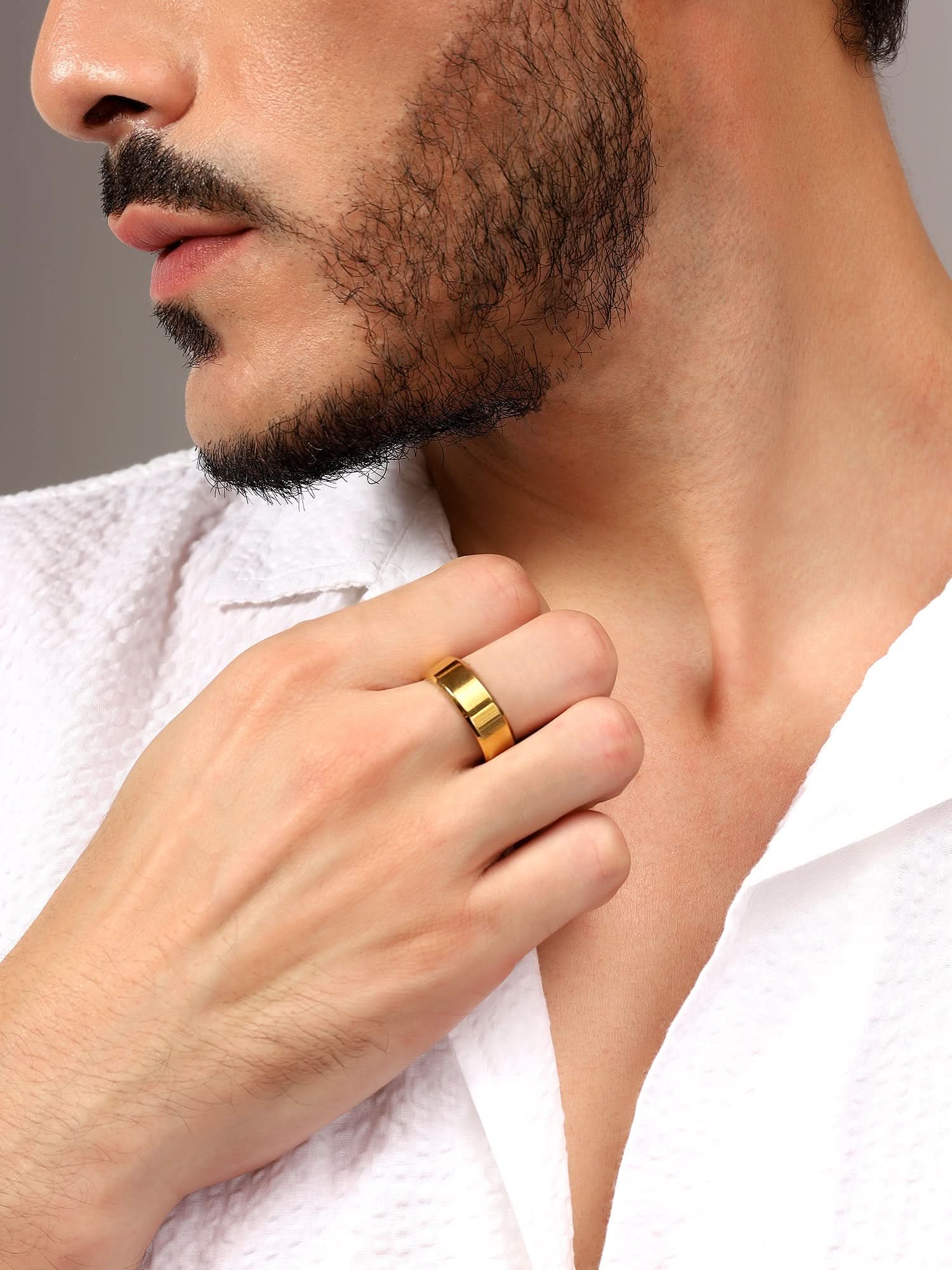 Model wearing Rectangle Signet Ring in gold — men's gold ring styled on hand