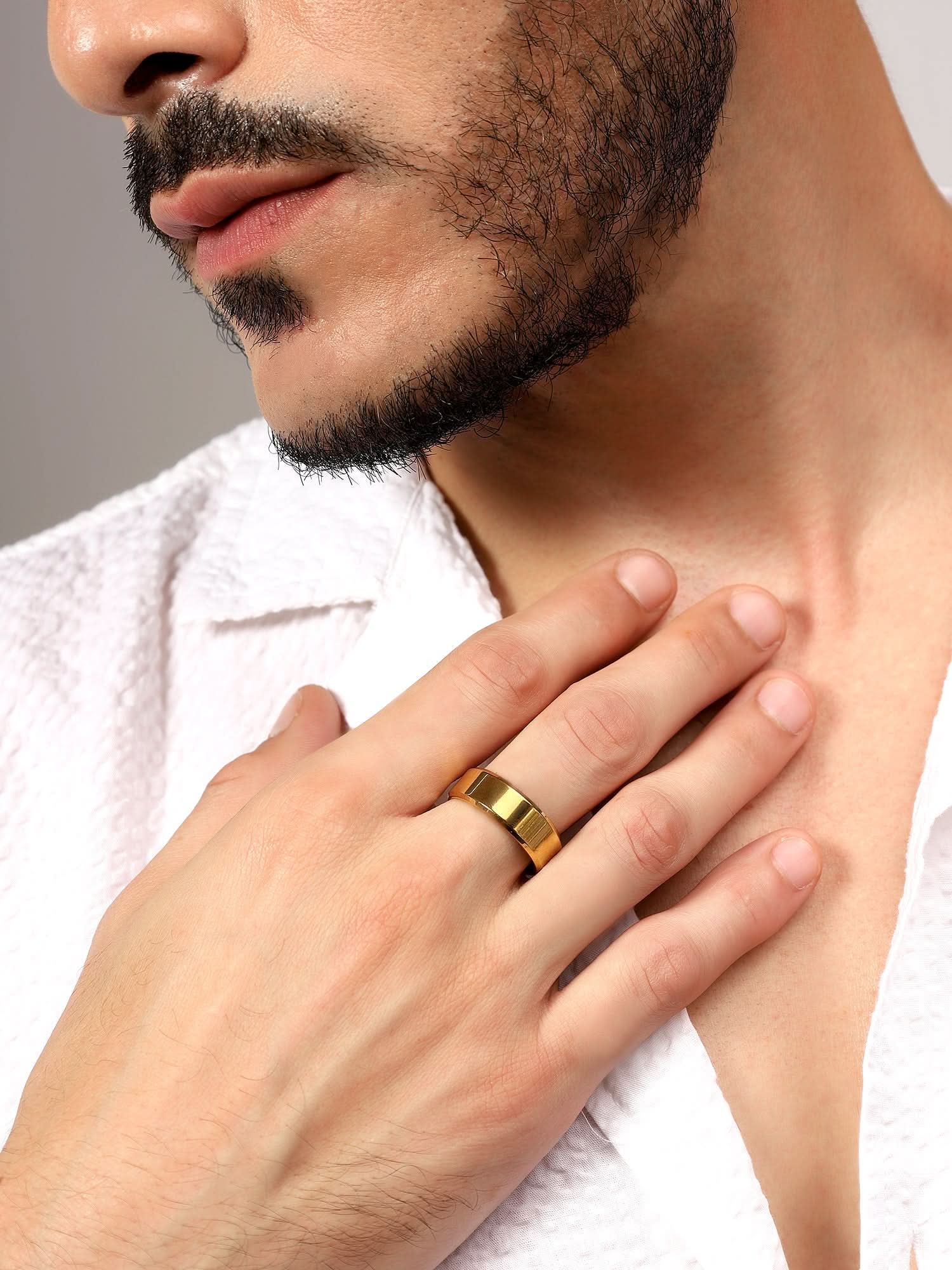 Model wearing Rectangle Signet Ring in gold — men's gold ring styled on hand