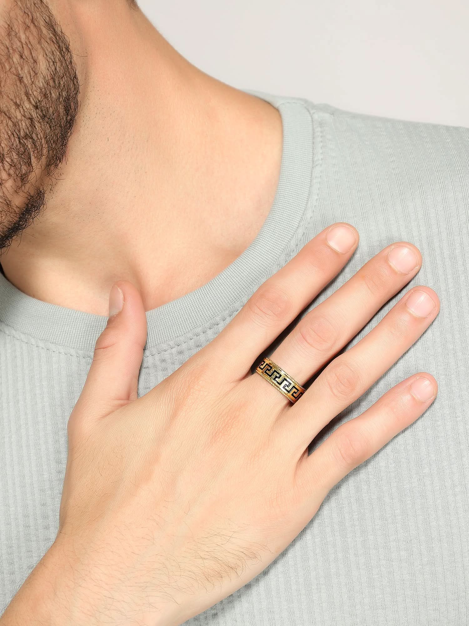 Model wearing Pattern Ring in gold — men's gold ring styled on hand