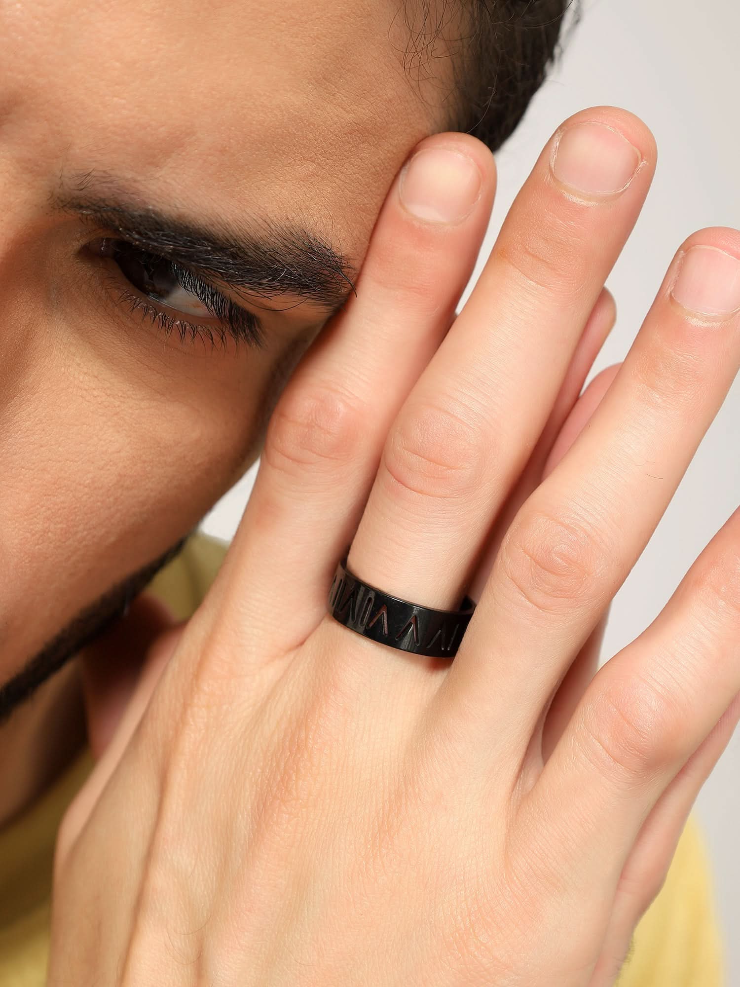 Model wearing Roman Numerals Ring in black — men's black ring styled on hand