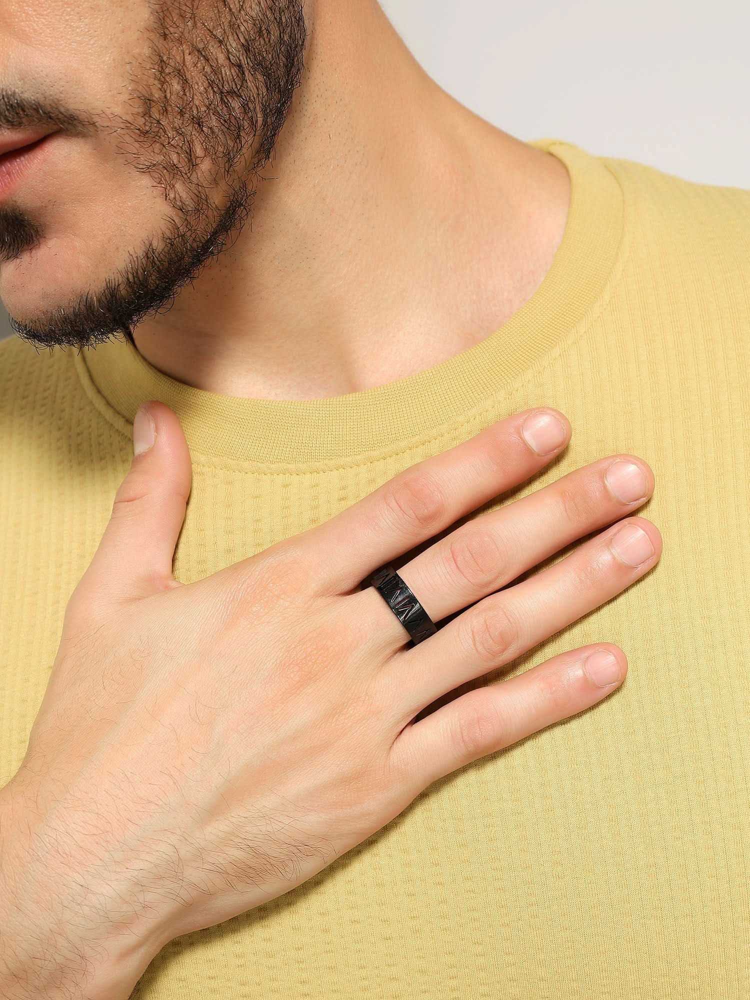 Model wearing Roman Numerals Ring in black — men's black ring styled on hand