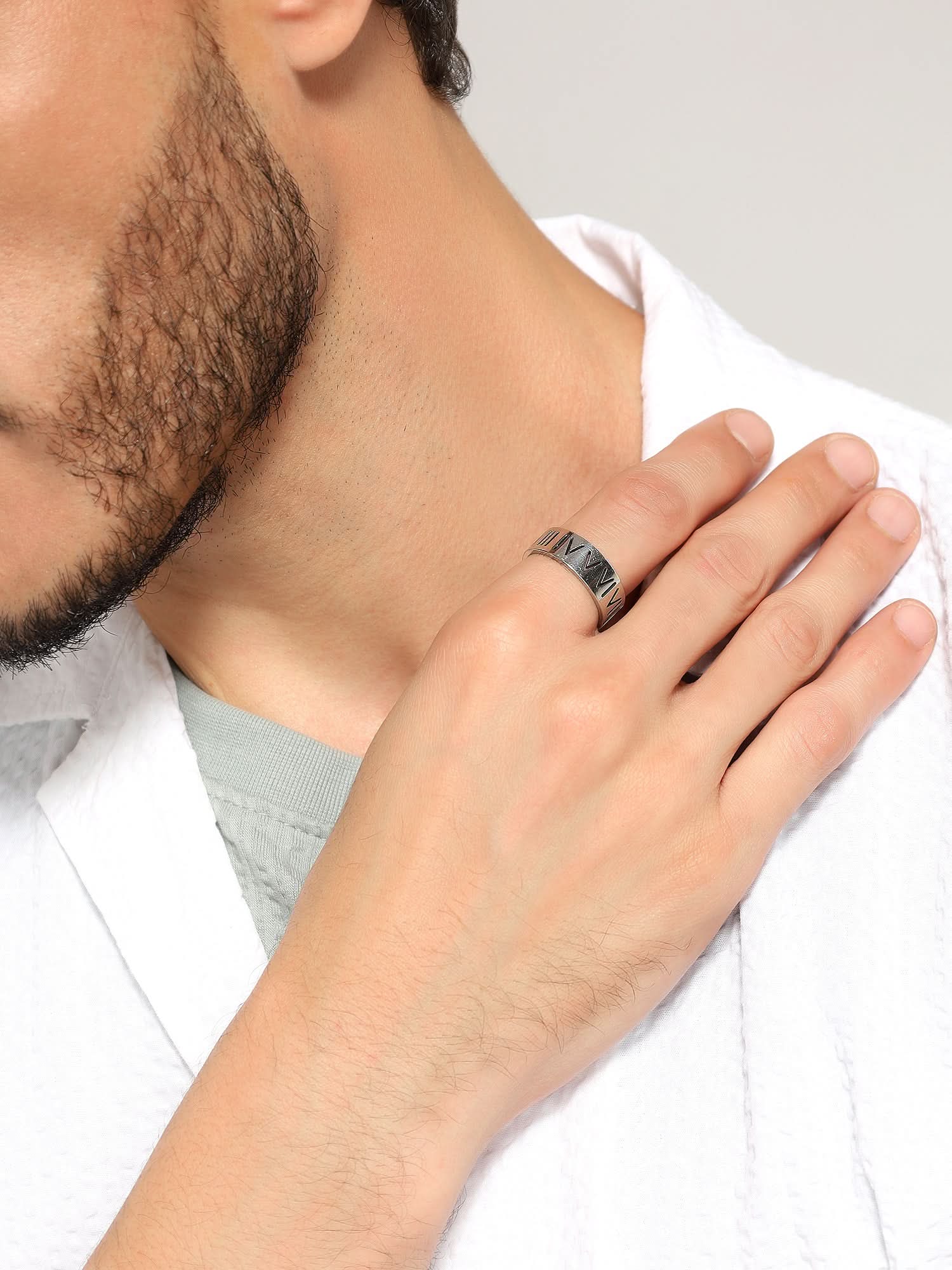 Model wearing Roman Numerals Ring in silver — men's silver ring styled on hand