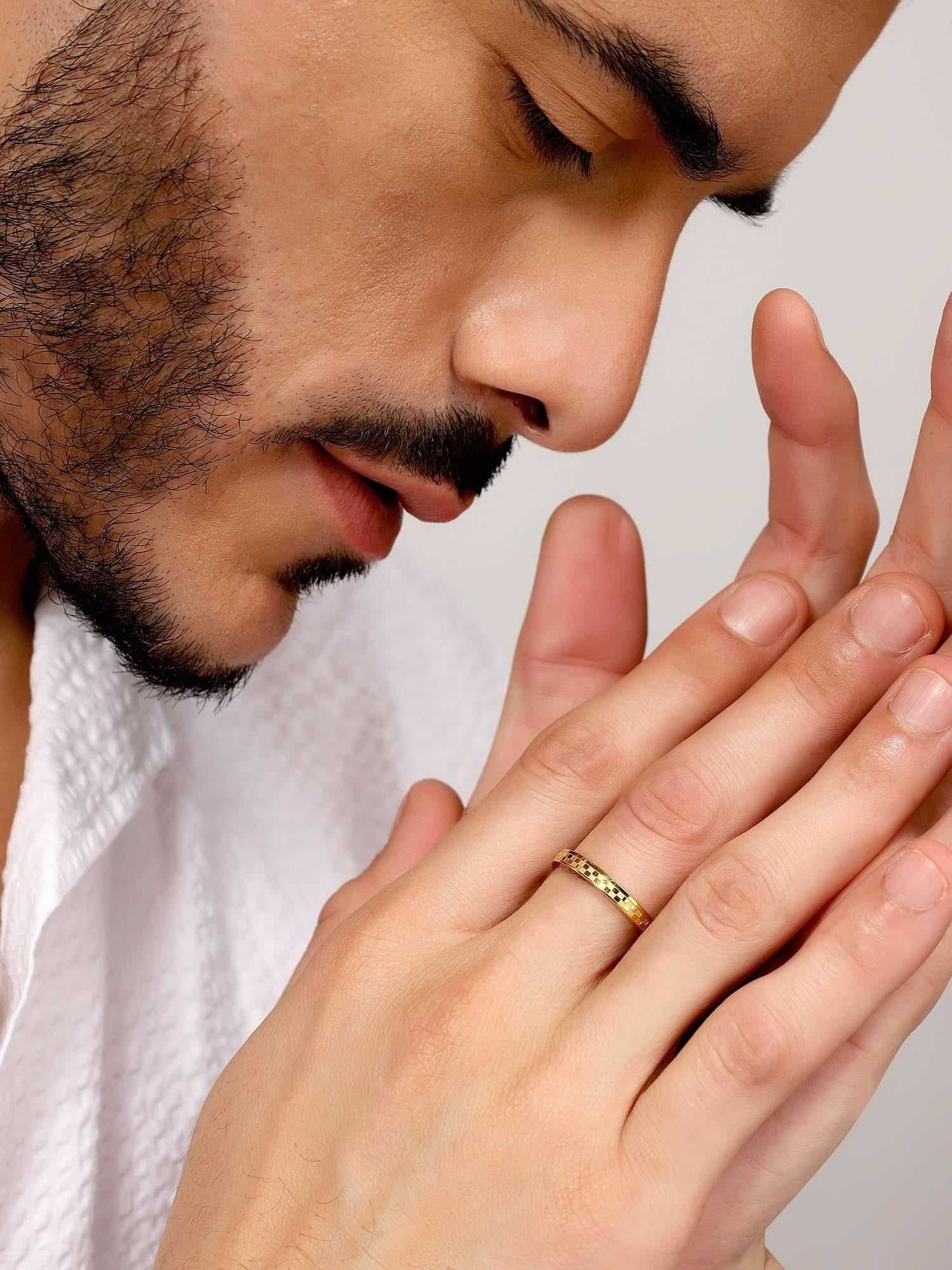 Model wearing Square Designer Ring in gold — men's gold ring styled on hand
