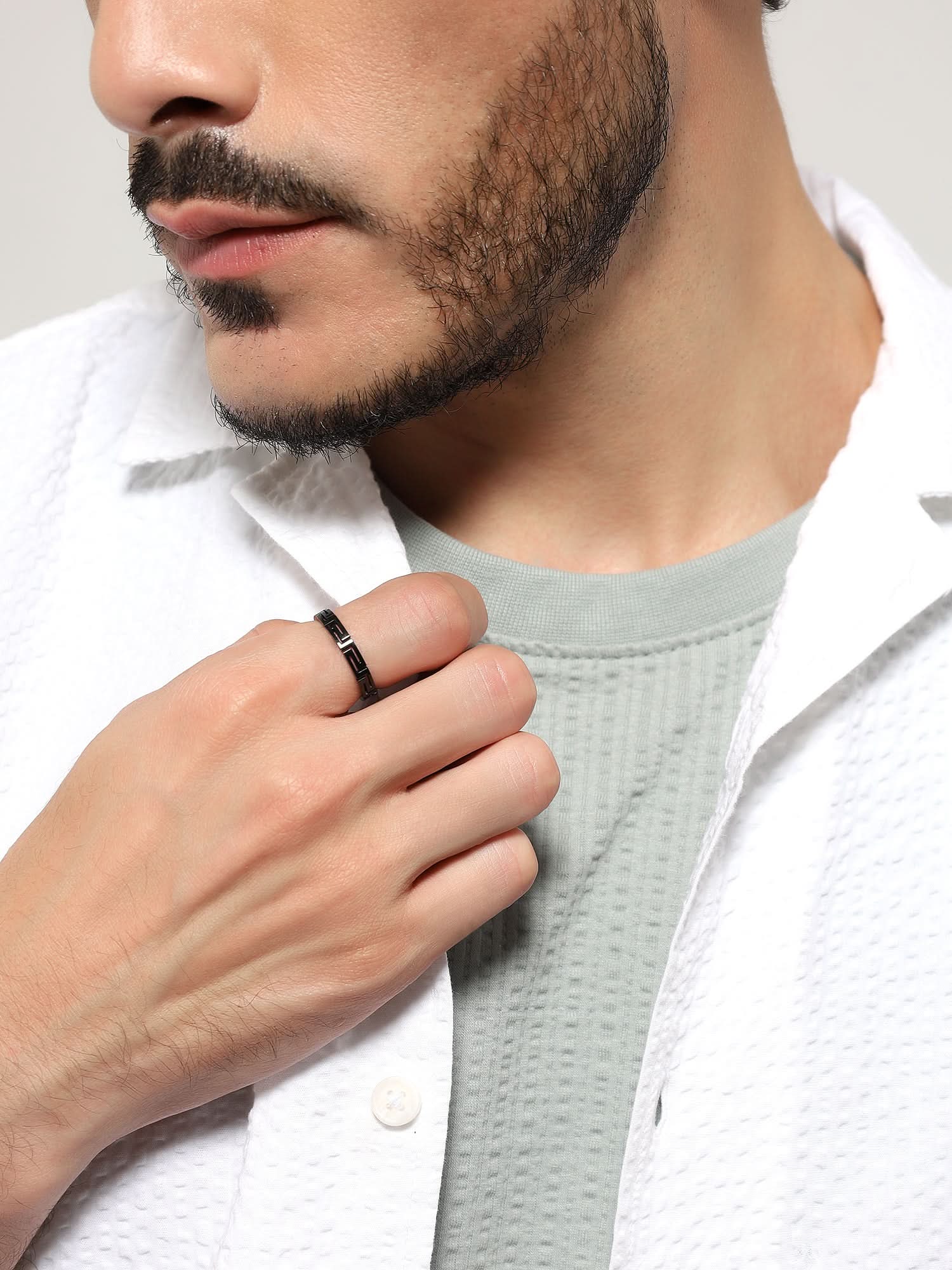 Model wearing Cutting Designer Ring in black — men's black ring styled on hand