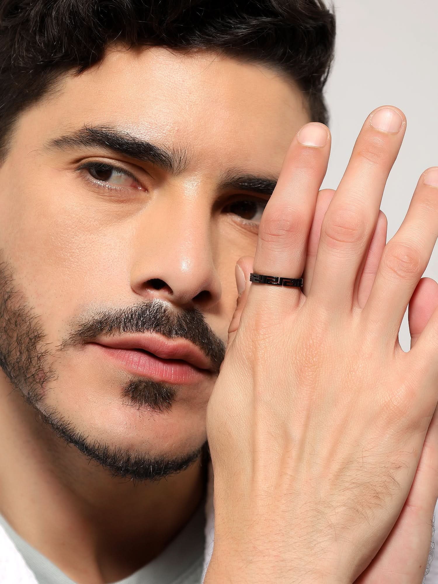 Model wearing Cutting Designer Ring in black — men's black ring styled on hand